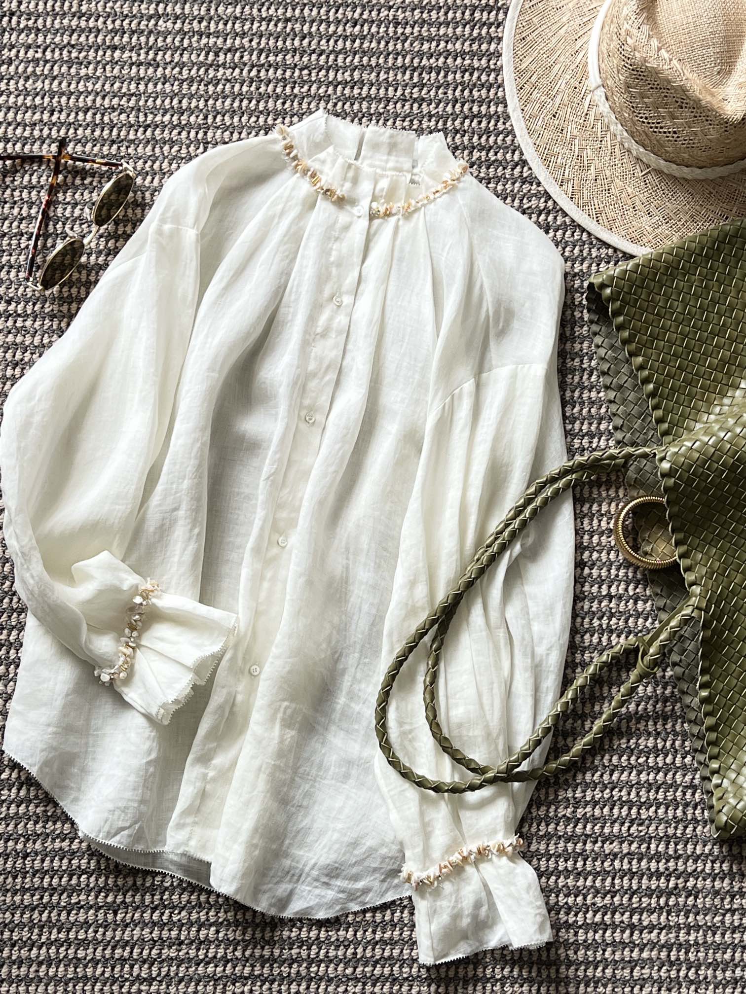 NO:312218,New product sharing [SS25 HEMP | Undercurrent Breathing Shirt] Hemp yarn weaving is ultra-lightly woven, thin and transparent like a cicada wing. The half-high collar pleat shows the romantic and playful meal, and the hand-pinching pleats on the collar and cuffs are adopted. The pleat error of each piece is ≤0.3mm. The collar/cuff hand-made beads are arranged along the bottom of the pleat valley, and the eyes are lit!  The armpit reserve falls on the shoulder slope to achieve the feeling of weightlessness of 