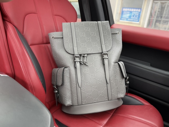 Gucci Embossed Logo Backpack - Gray Leather Travel Bag for Men 1 Gucci Embossed Logo Backpack - Gray Leather Travel Bag for Men