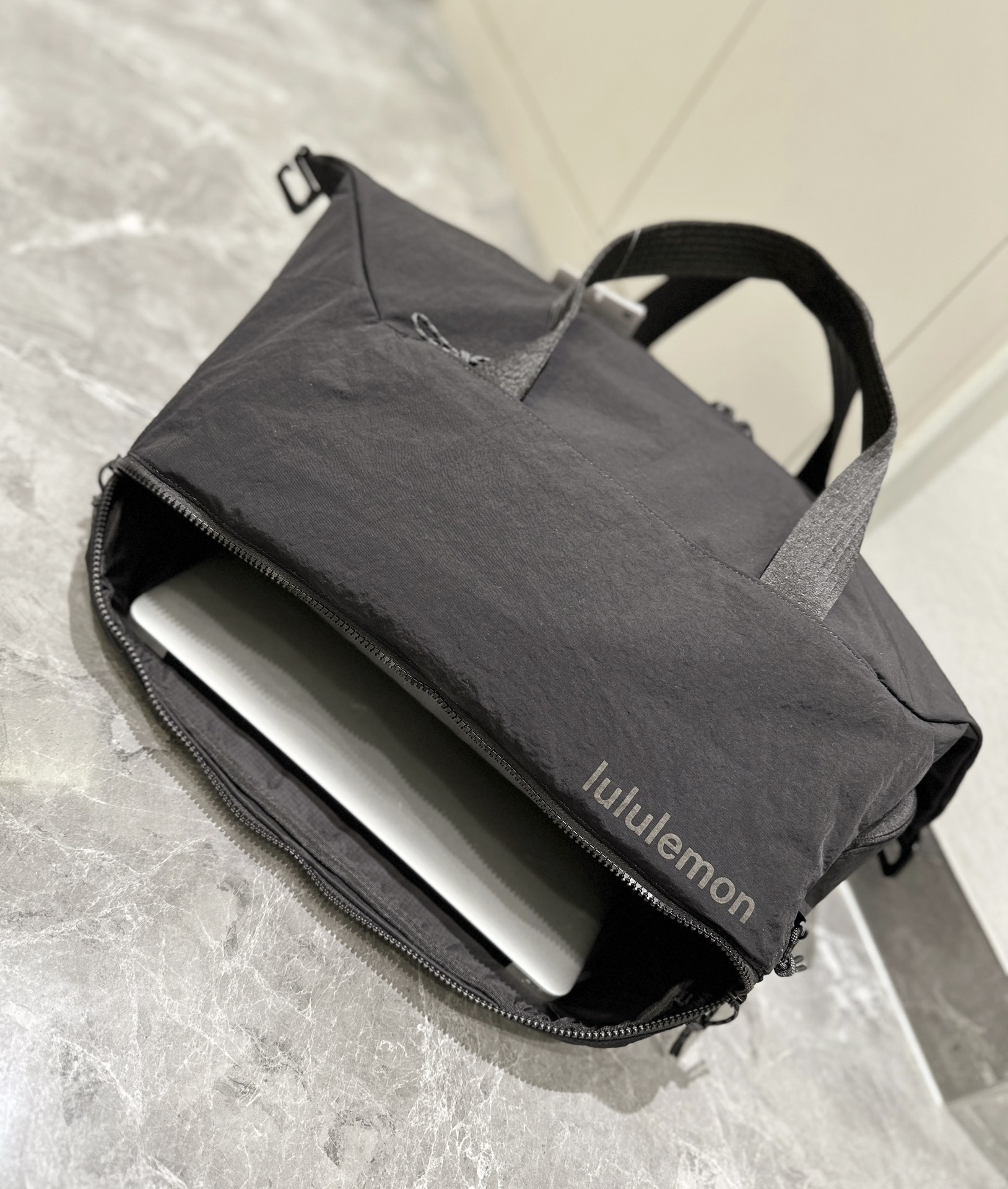 The spacious interior accommodates footwear, apparel, a laptop, an - Comprehensive 4