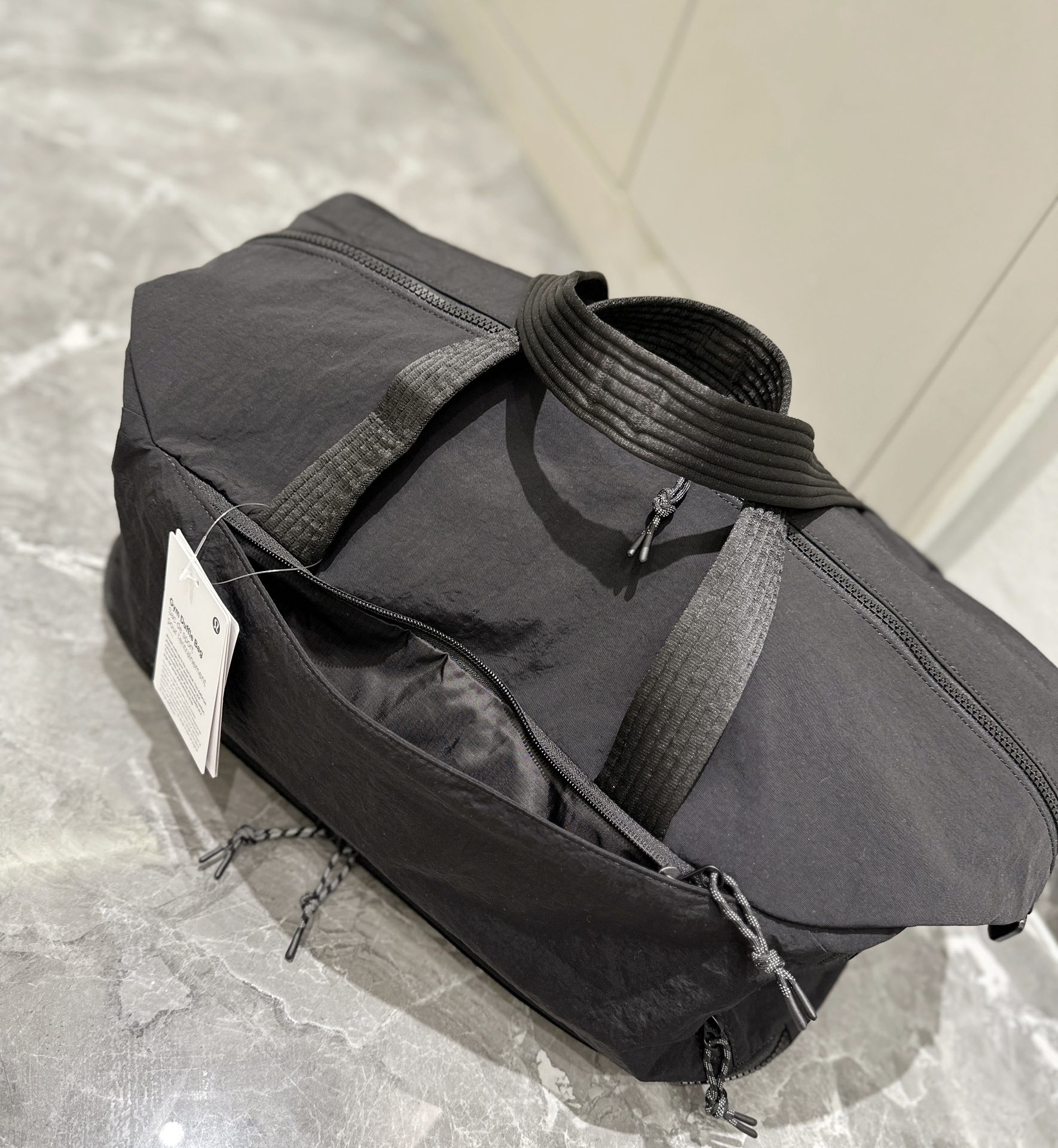 The spacious interior accommodates footwear, apparel, a laptop, an - Comprehensive 2