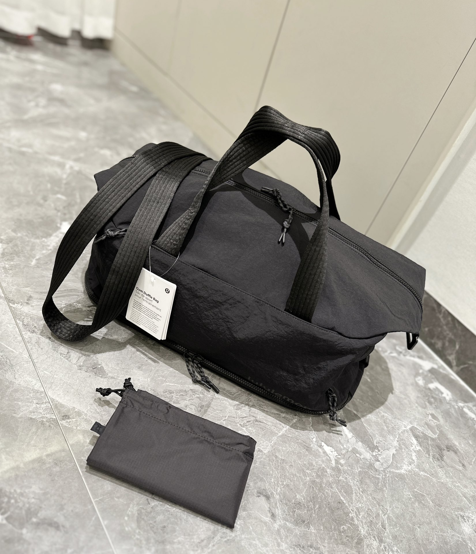 The spacious interior accommodates footwear, apparel, a laptop, an - Comprehensive