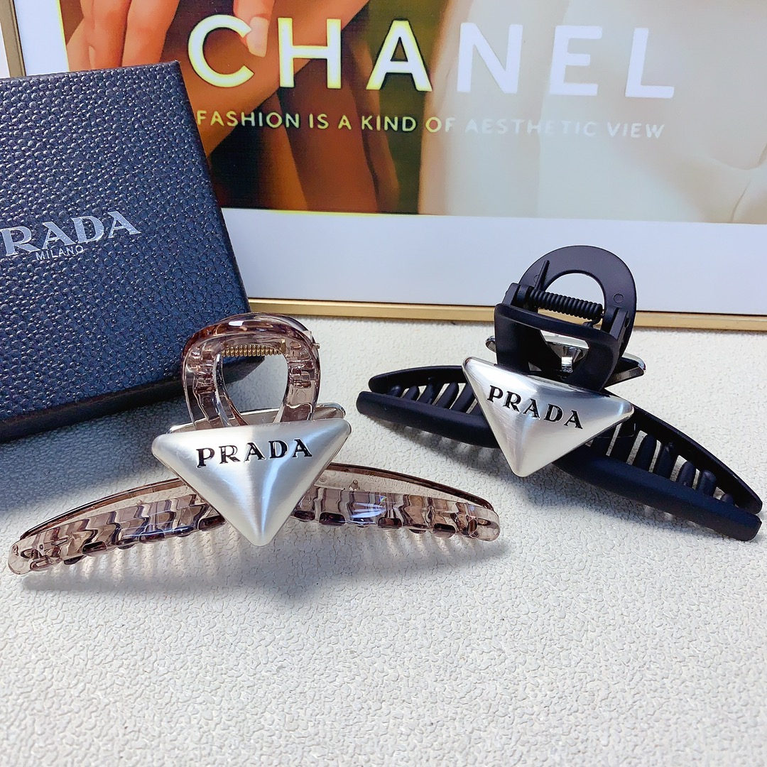 99 Prada Prada Prada. The new triangle logo grabs, it’s all in the air