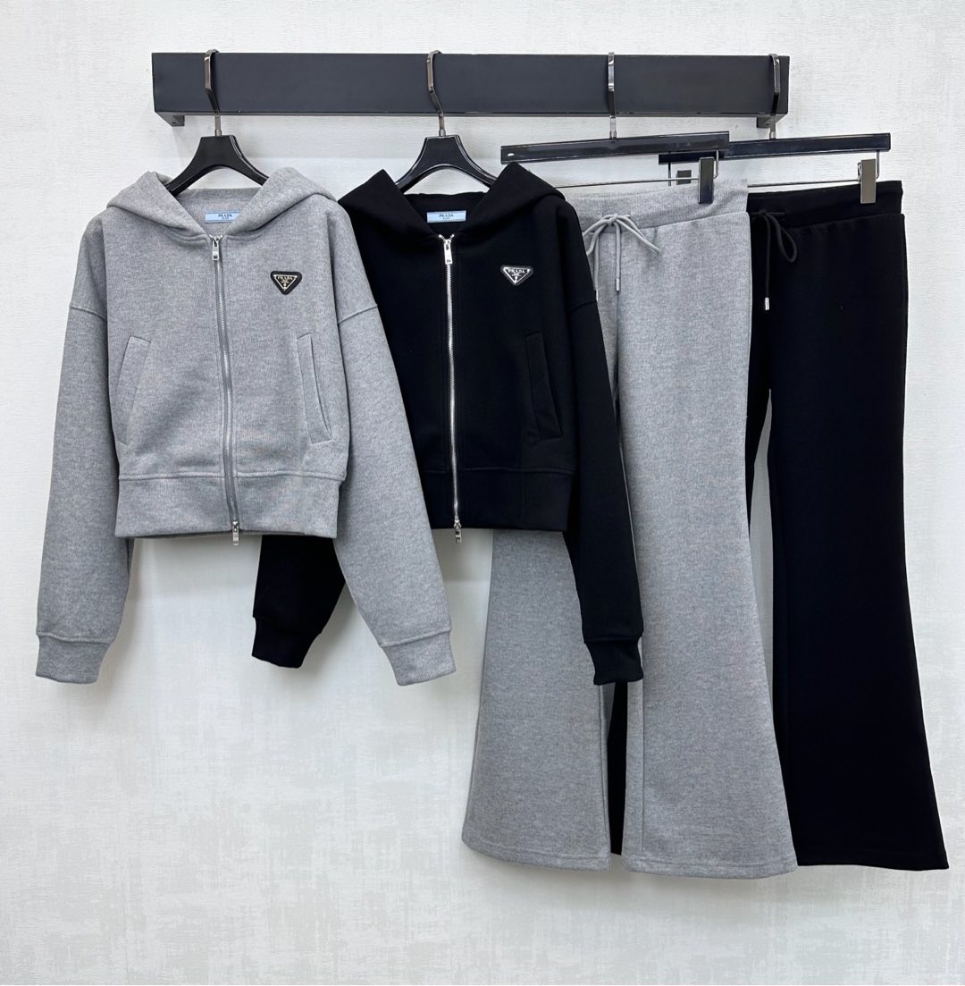 NO:609960,Prad*2025 new products are on the shelves. Hooded jacket and trousers suit. Customized YB imported material. Sleek and stylish. Full texture. The placket is adjusted with an engraved zipper to match the drawstring design on the bottom. Matching details of the hem and cuffs are threaded to add layering to the look. The iconic metal triangle logo element is embellished on the chest, echoing the waist and hip details. Highlighting the brand's tone. Development of surface accessories. Zippered sweatshirt jacket straight-leg trousers suit tailoring. The complete set is casual and fashionable.  High version 2 colors,,prada,hoodie,sweatshirts,jackets & coats,hats,alexander wang19860909Prad*2025新品上架 连帽外套长裤套装 定制YB进口材质 垂顺有型 质感十足 开襟沿用刻印拉链调节配合下装抽绳设计 搭配衣摆和袖口螺纹包边细节处理 增添造型层次感 胸前点缀标志性金属三角徽标元素 与腰胯细节上下呼应 彰显品牌调性 面辅料开发 拉链卫衣外套直筒长裤套装剪裁 成套穿搭休闲时髦  高版本2色,,prada,hoodie,sweatshirts,jackets & coats,hats,alexander wang,Women's clothing