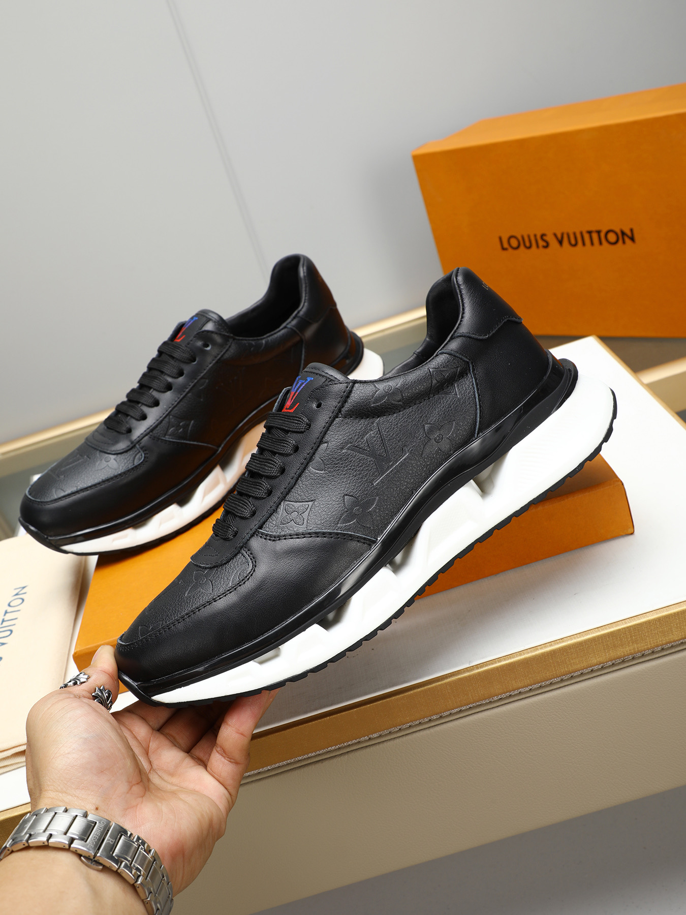 Louis Vuitton Men's Black Leather Sneaker with Embossed Monogram Pattern 3 i1743235531607 3939 0 1
