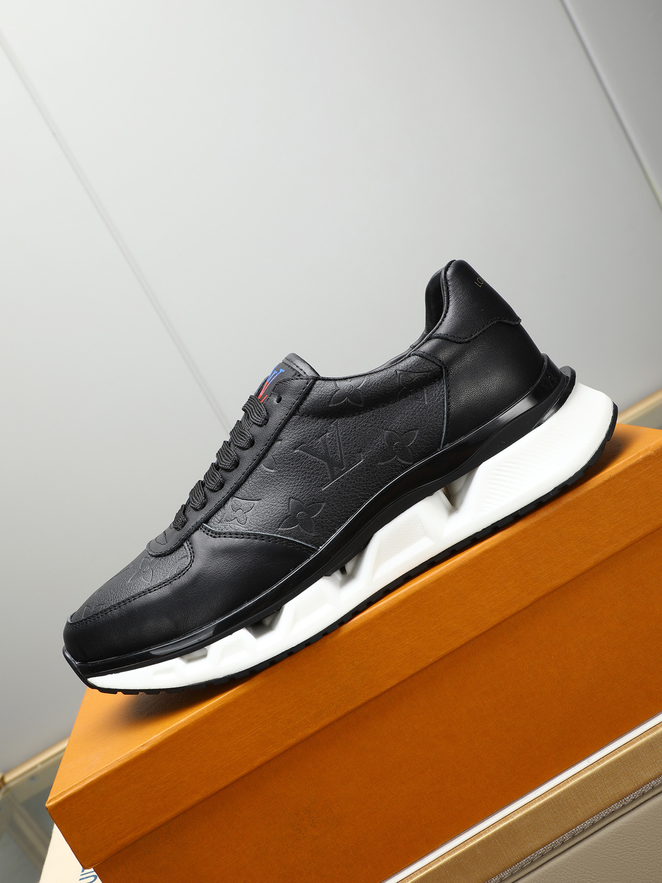 Louis Vuitton Men's Black Leather Sneaker with Embossed Monogram Pattern 7 i1743235531607 7442 0 5