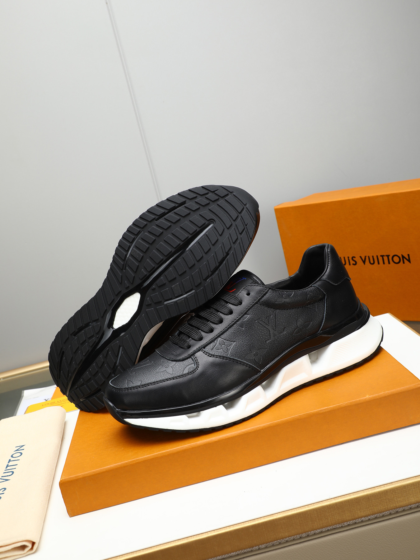 Louis Vuitton Men's Black Leather Sneaker with Embossed Monogram Pattern 4 i1743235532264 3840 0 2
