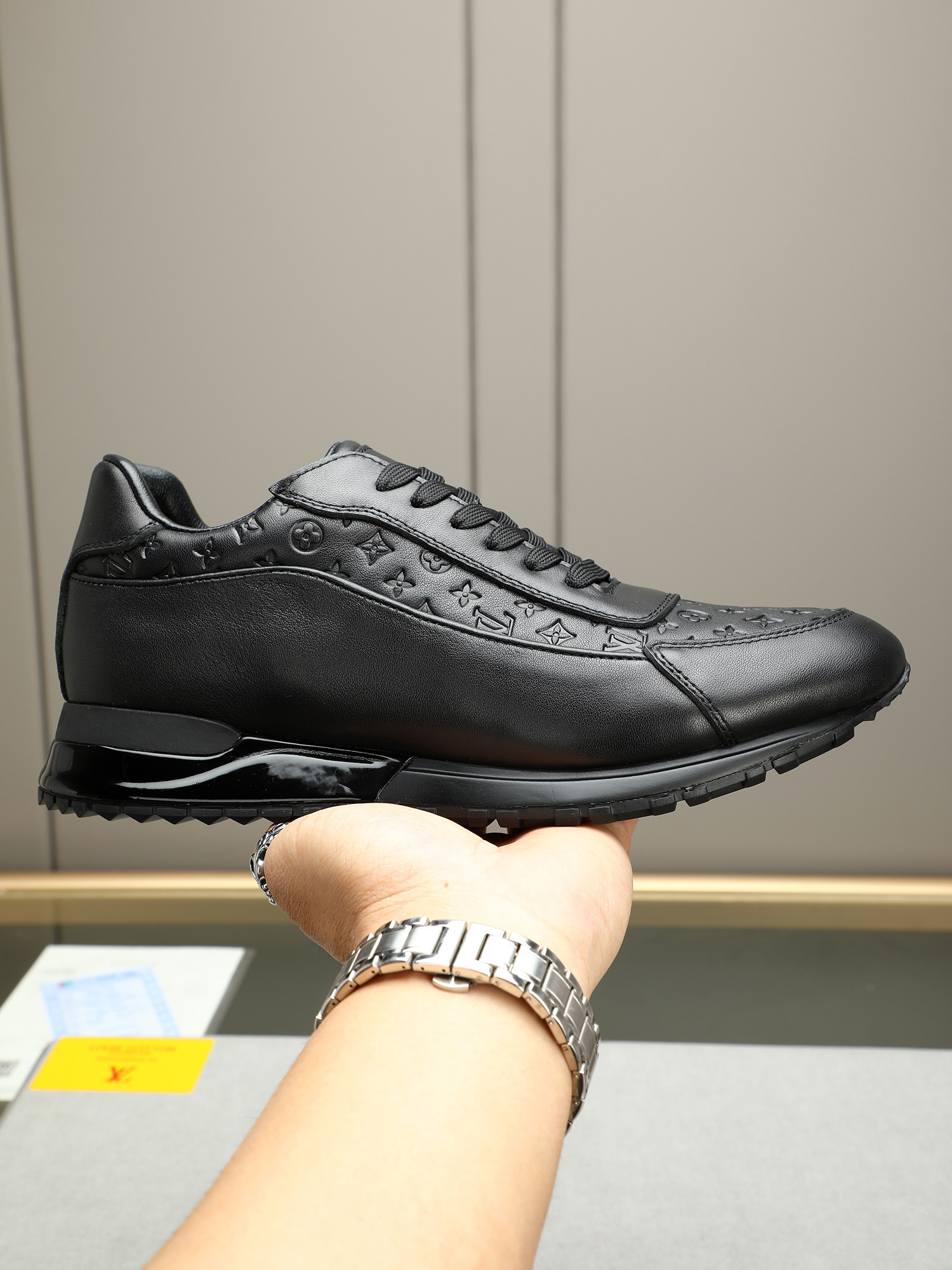 Louis Vuitton Men's Black Leather Sneakers with Monogram Embossed Design 2 i1744796376222 1463 0 0
