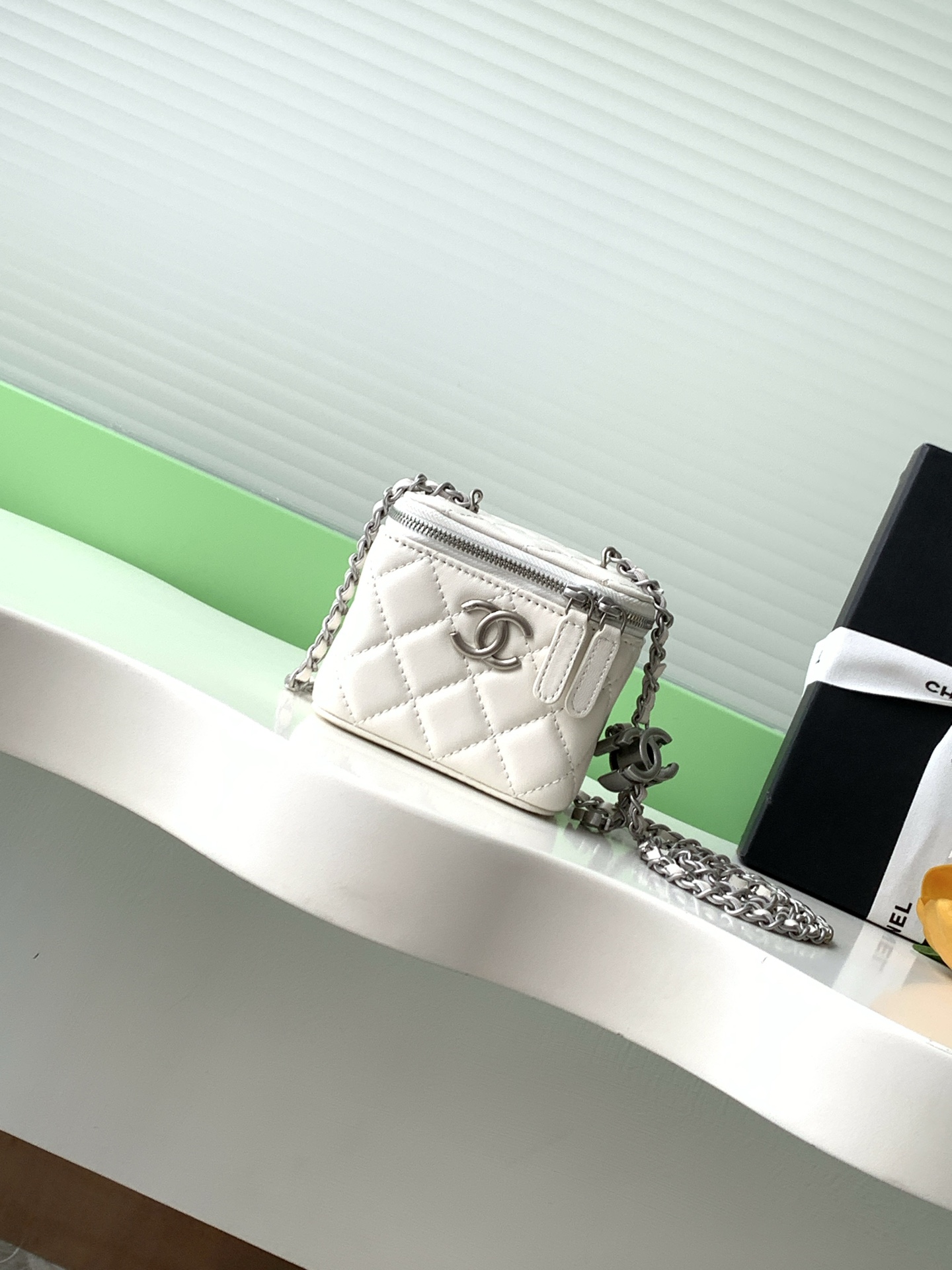 Elegant Lambskin Vanity Case with Enamel Logo & Adjustable Chain