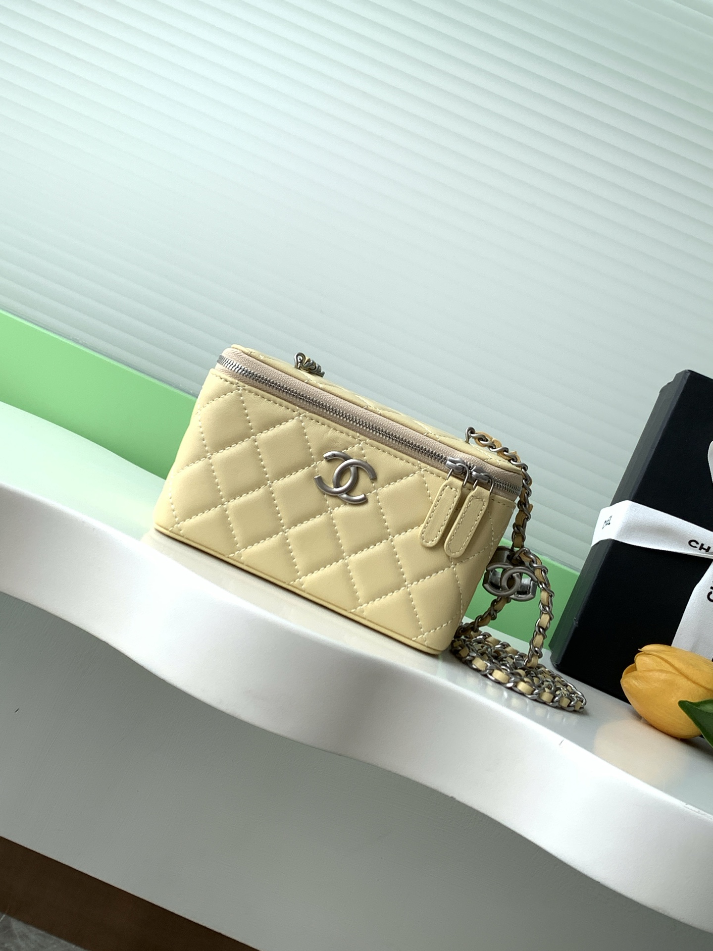 Elegant Lambskin Vanity Case with Enamel Logo & Adjustable Chain Strap