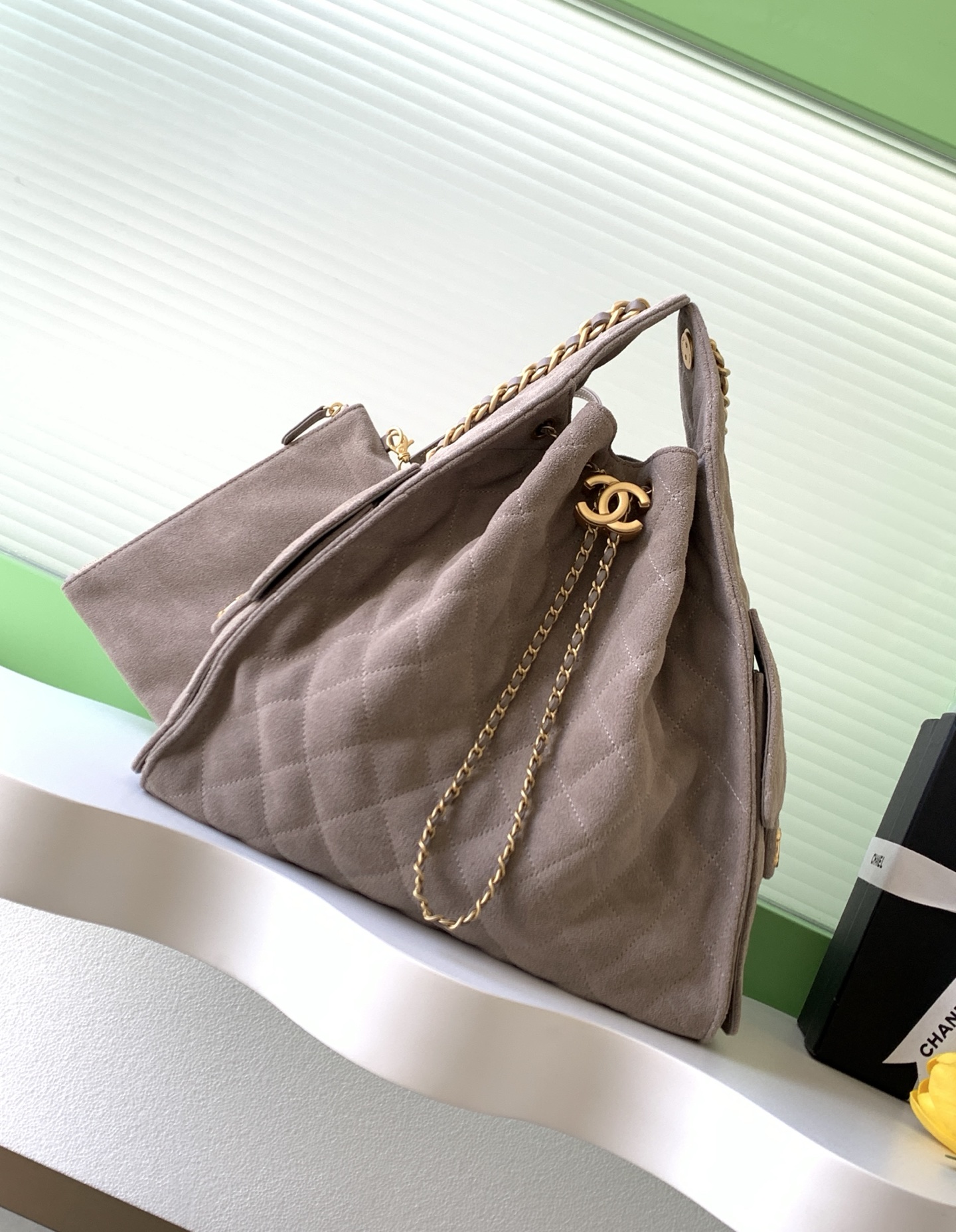Elegant Suede Bucket Bag with Quilted Pattern and Chain Detail