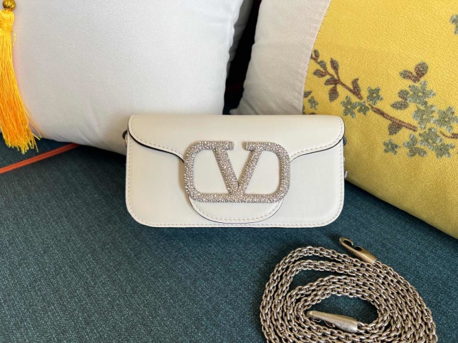Valentino Garavani Mini Locò Crystal-Embellished Leather Shoulder Bag 1 Valentino Garavani Mini Locò Crystal-Embellished Leather Shoulder Bag