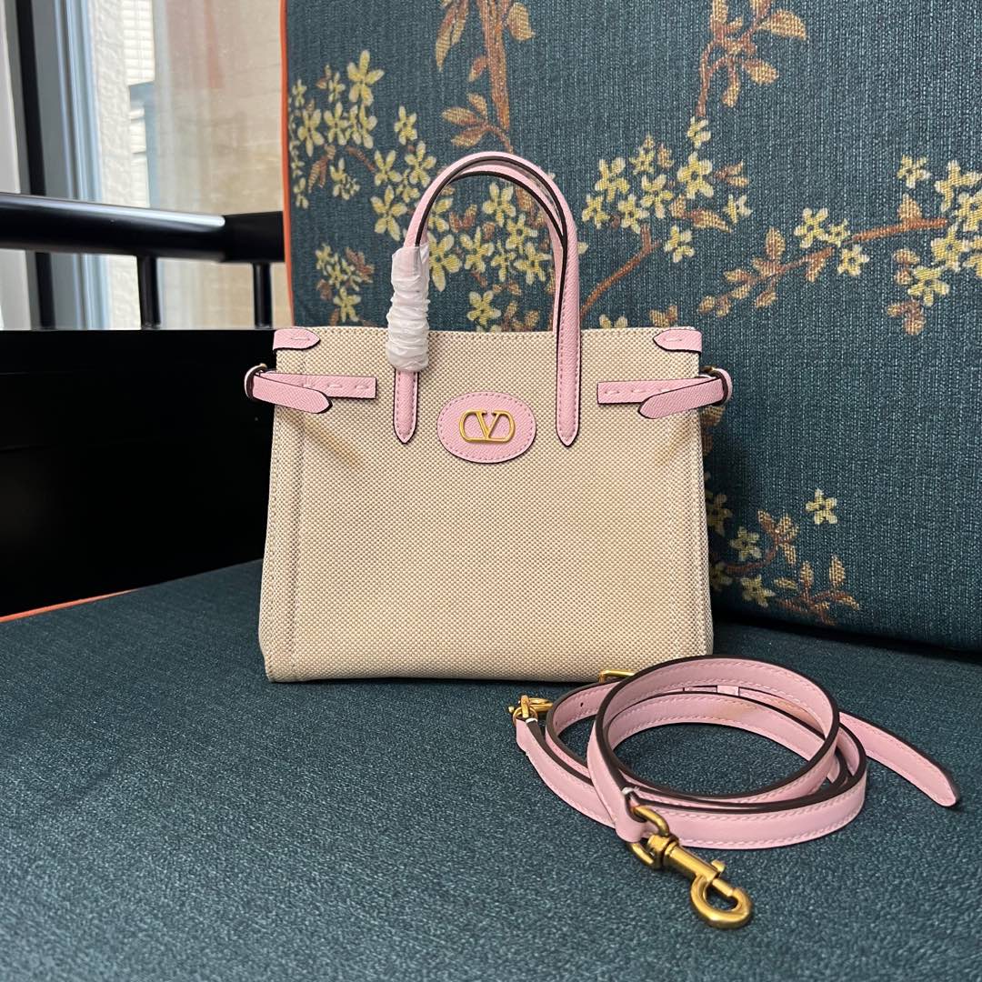 2016S Garavani Antibes Handbag with VLogo Signature Metal Elements Summary: Small handbag with versatile carrying options, gold accessories, magnetic closure, protective base, inside zipper, and adjustable