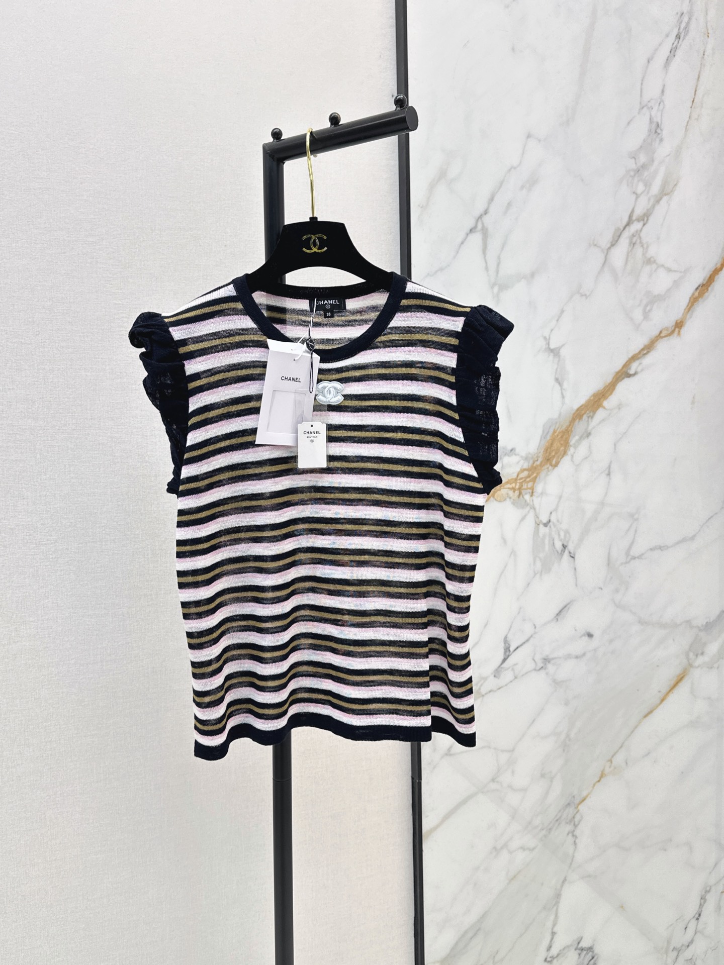 NO:874338,C Home 26Ss————The latest striped sweater for spring and summer. The colorful stripes are fresh and lively. Double C embellishment on the chest. Hollow crocheting process. Breathable and light. Super comfortable to wear in spring and summer. Round neck design. Versatile for daily leisure or vacation. It goes well with skirts or loose pants. Two colors are available now. sml, chanel, skirts,19860909C家 26Ss————春夏最新款条纹针织衫彩色条纹清新又活泼 胸前双C点缀 镂空钩织工艺 透气轻盈 春夏穿超舒服 圆领设计 日常休闲或度假都很百搭 随手搭裙装或宽松裤都很出彩 两色现货发售sml,,chanel,skirts,,Women's clothing