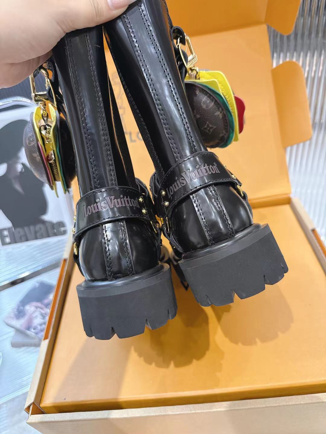LV x Timberland Collab Black Leather Ankle Boots with Burger Charm 9 a1757509379635 1773