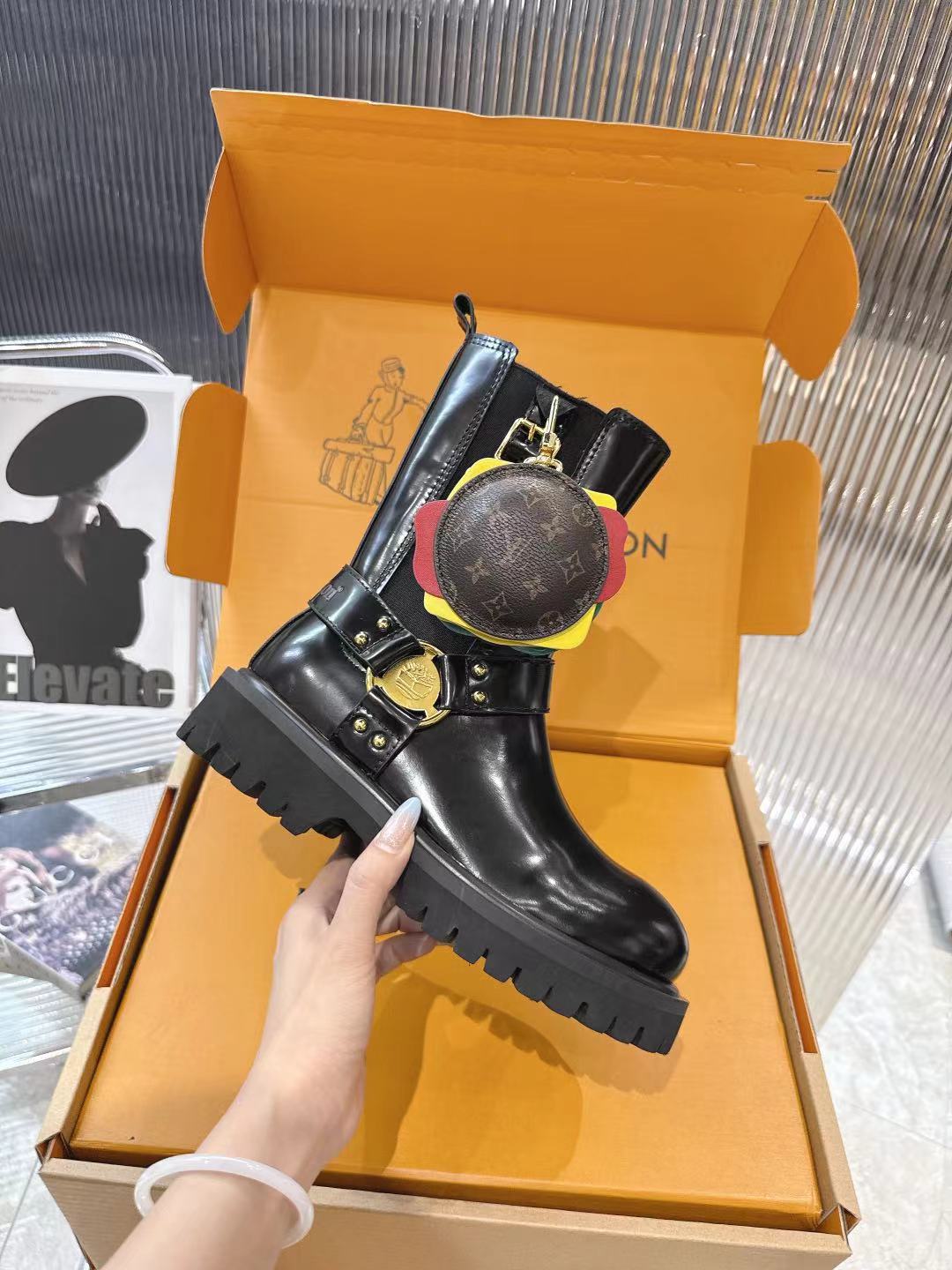 LV x Timberland Collab Black Leather Ankle Boots with Burger Charm 2 a1757509379635 2256