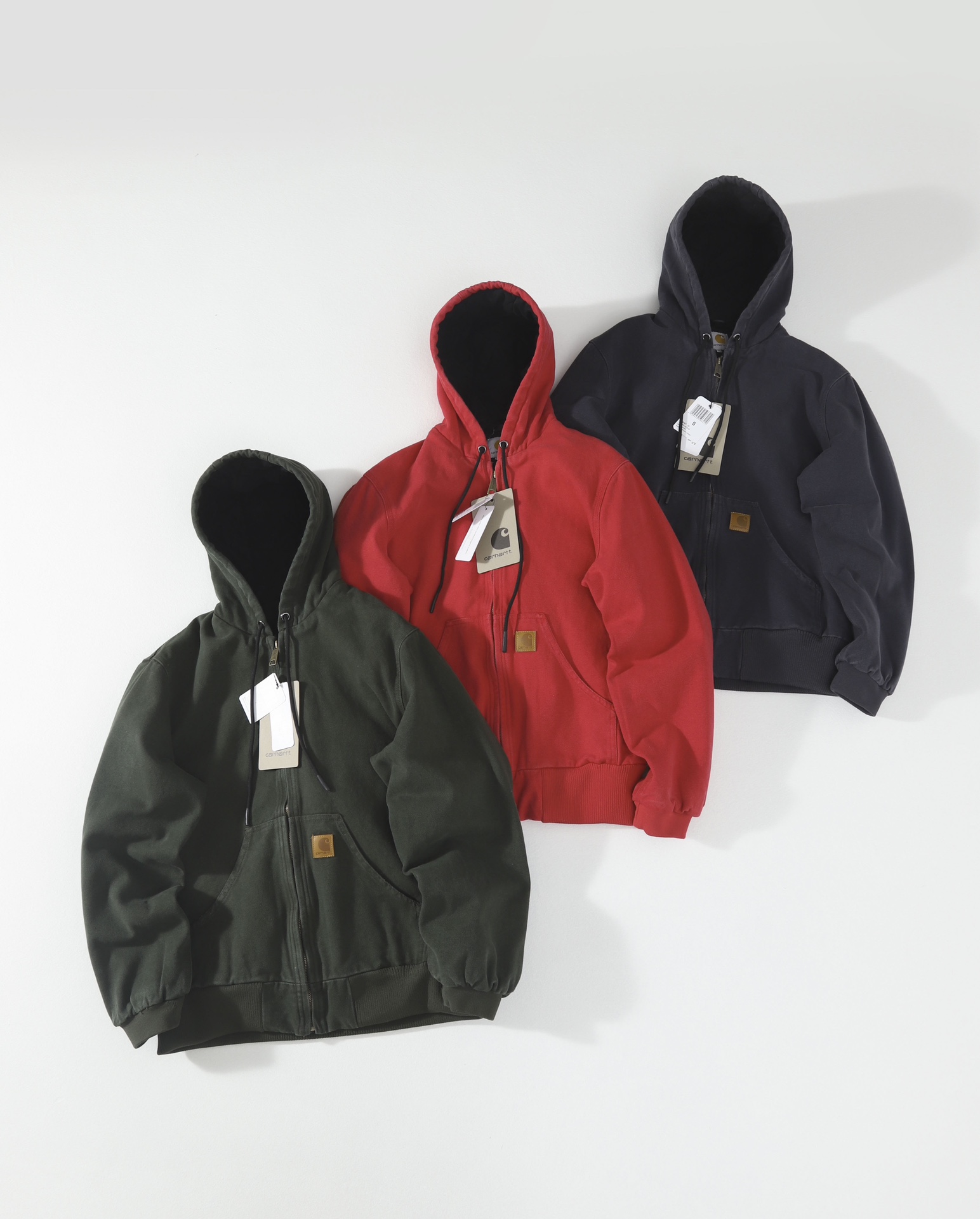 AMB 2320 Cotton Jacket by Carhart: Black, Moss Green, Red. Sizes: S, M, L, XL.
