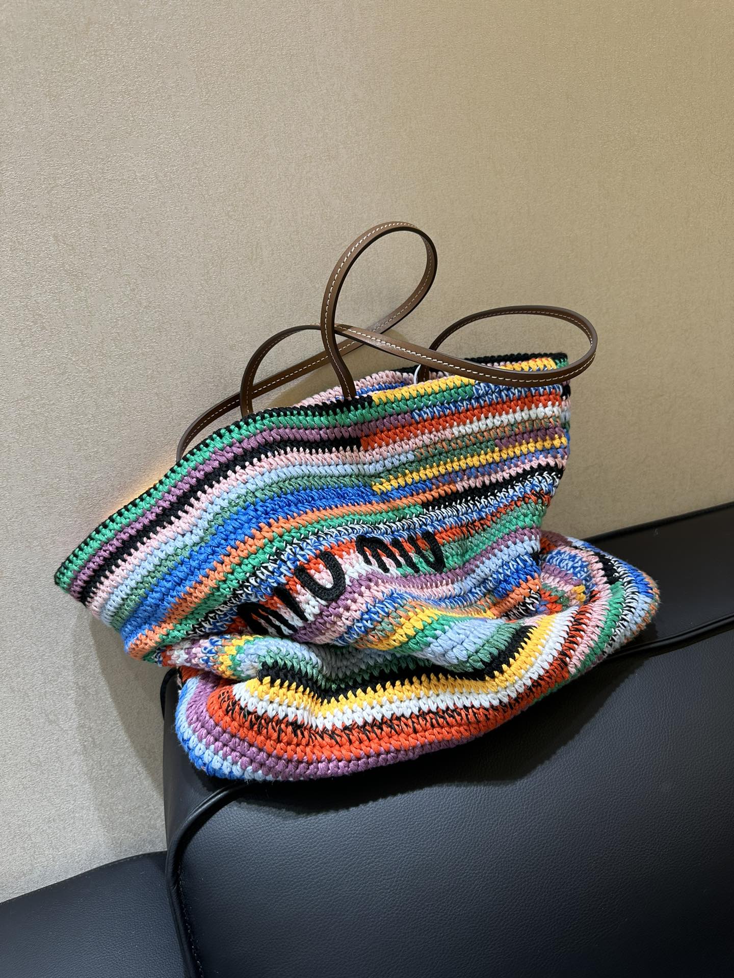 Miu Miu Handmade things are the most warm. They are crocheted with wool thread, which makes the bag lighter. The gorgeous colorful stripes are fu