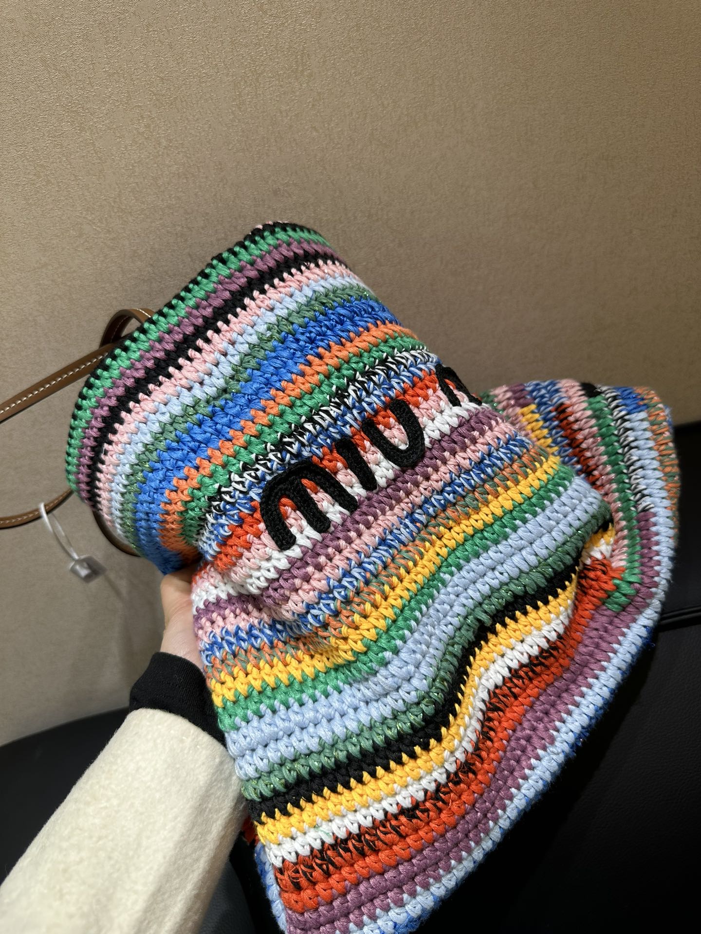 Miu Miu Handmade things are the most warm. They are crocheted with wool thread, which makes the bag lighter. The gorgeous colorful stripes are fu
