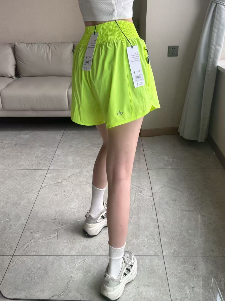 Alo shorts run neon yellow