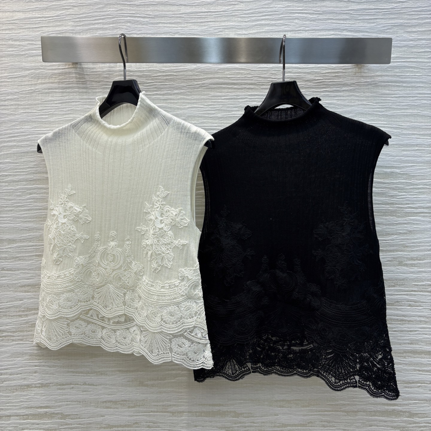 Handmade Lace Vests and Woolen Twirls: Fashionable Monotrons in Two Colors.