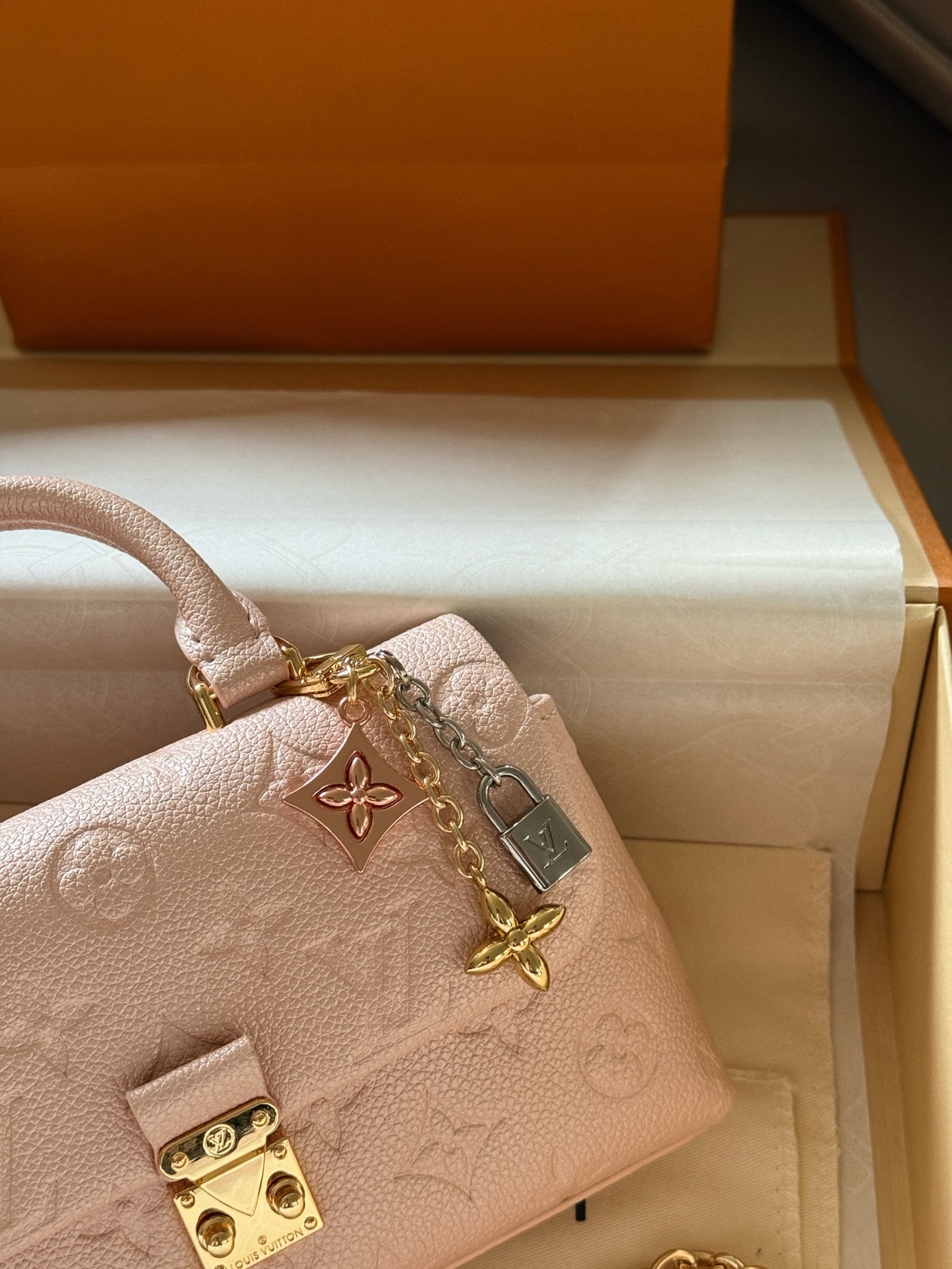 Louis Vuitton Madeleine Pearlescent light pink Monogram Empreinte leather mini crossbody