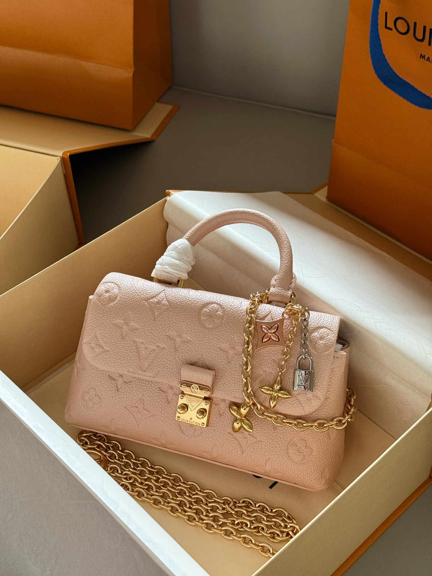 Louis Vuitton Madeleine Pearlescent light pink Monogram Empreinte leather mini crossbody
