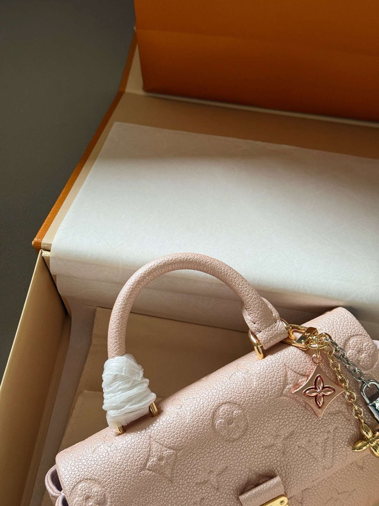 Louis Vuitton Madeleine Pearlescent light pink Monogram Empreinte leather mini crossbody