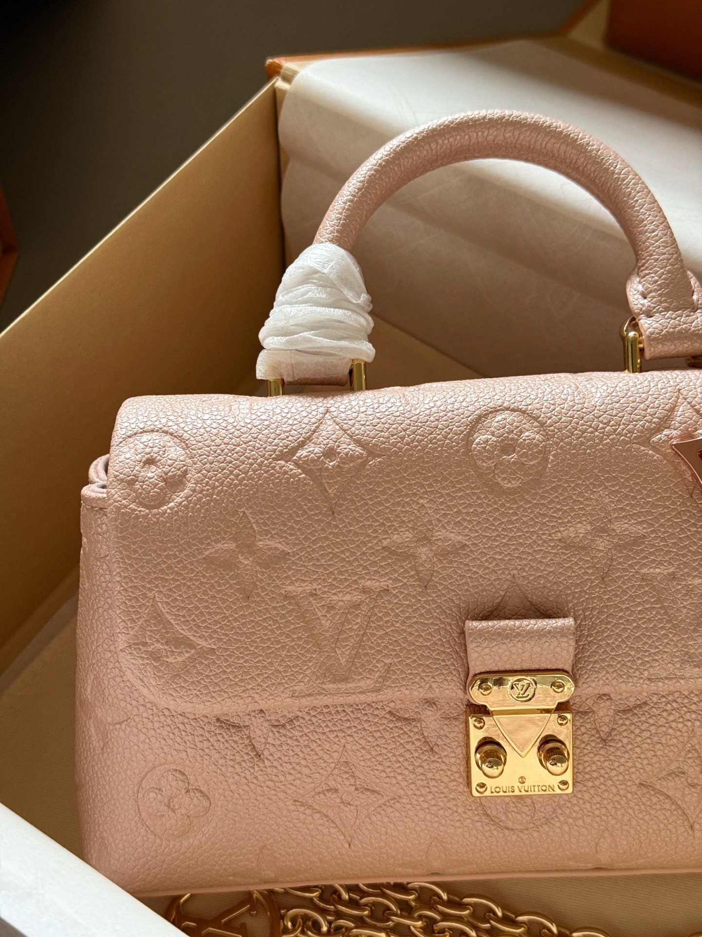 Louis Vuitton Madeleine Pearlescent light pink Monogram Empreinte leather mini crossbody