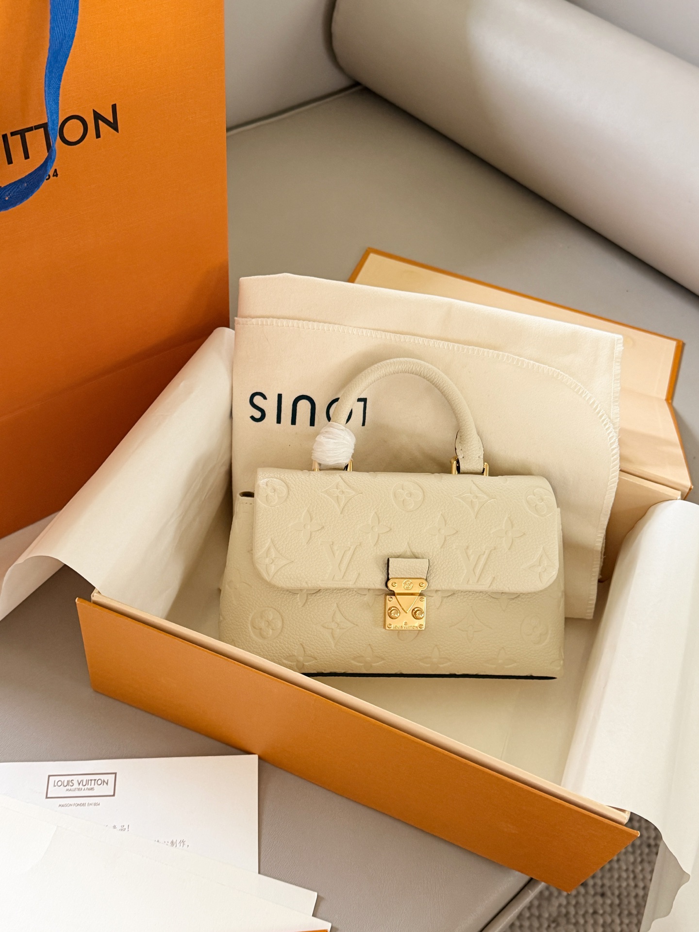 Louis Vuitton Madeleine Cream Monogram Empreinte leather mini shoulder