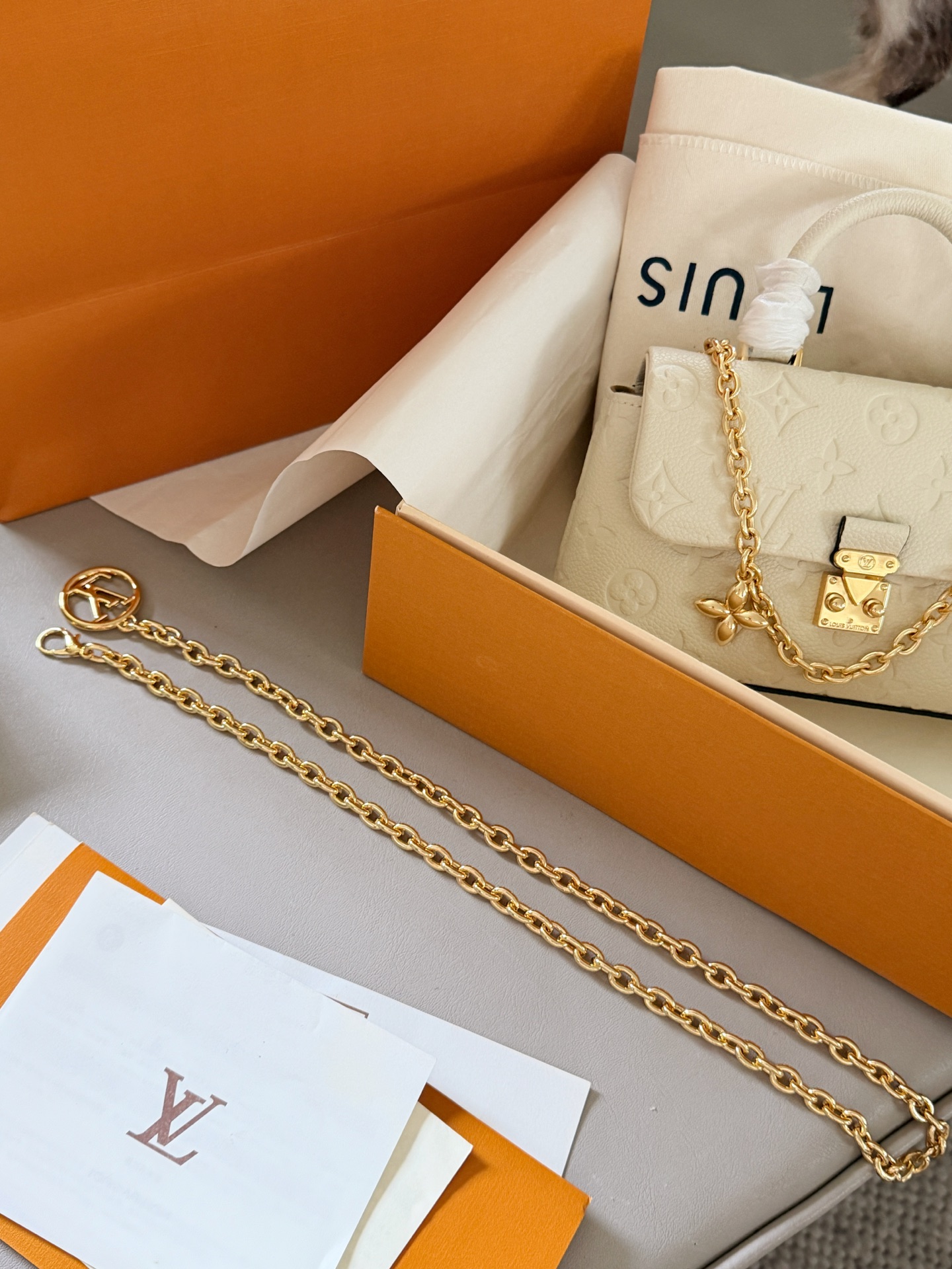 Louis Vuitton Madeleine Cream Monogram Empreinte leather mini shoulder