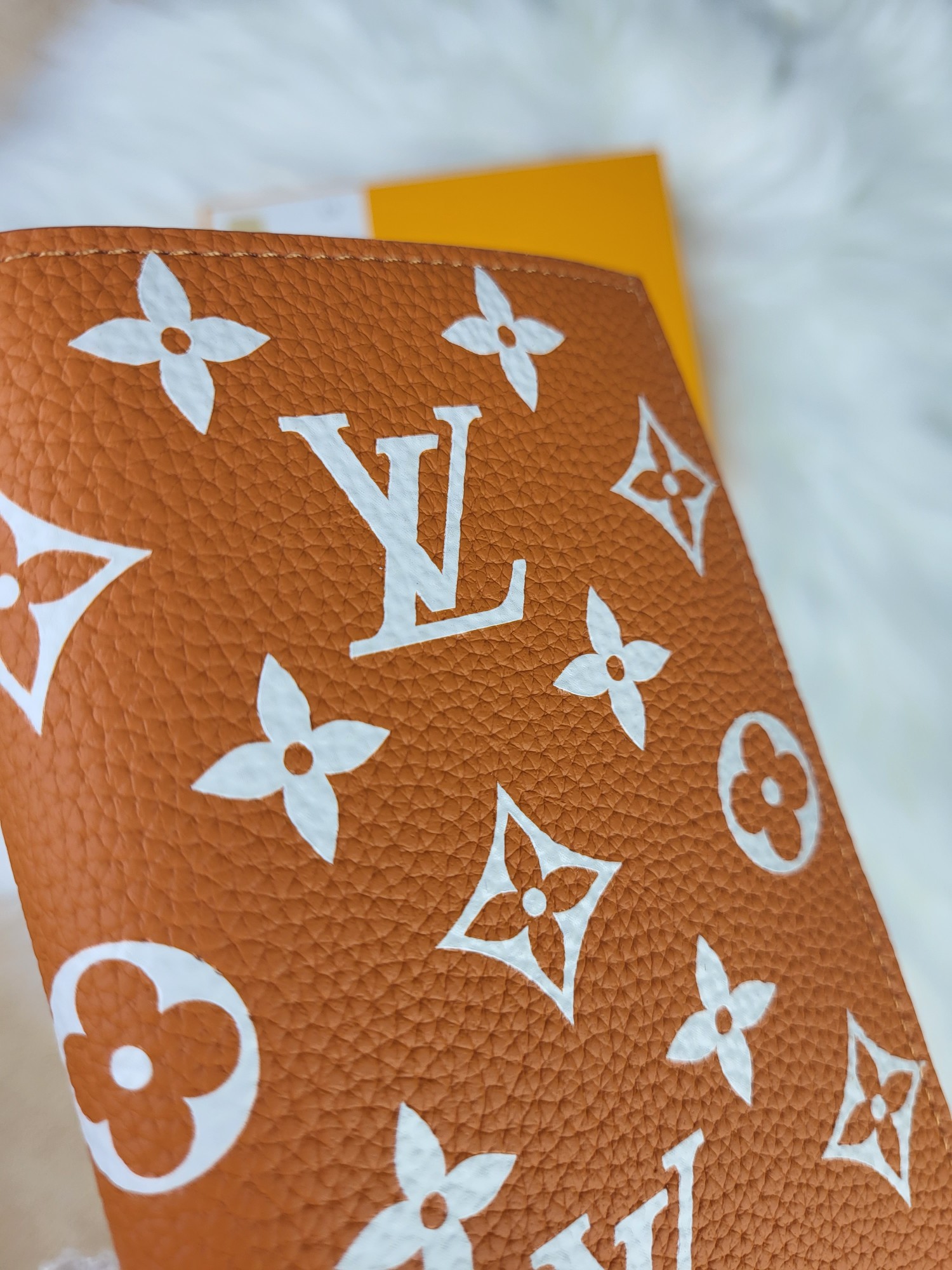 Passport cover shown with travel items