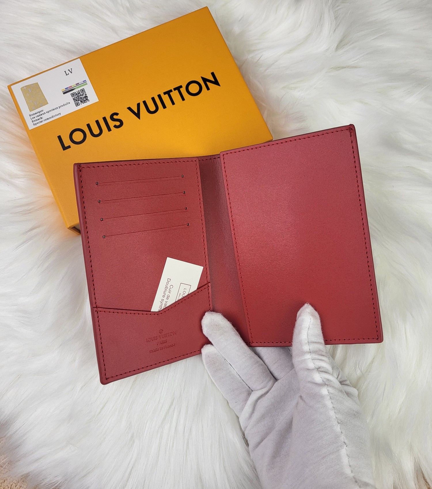 Passport cover in use, held by hand