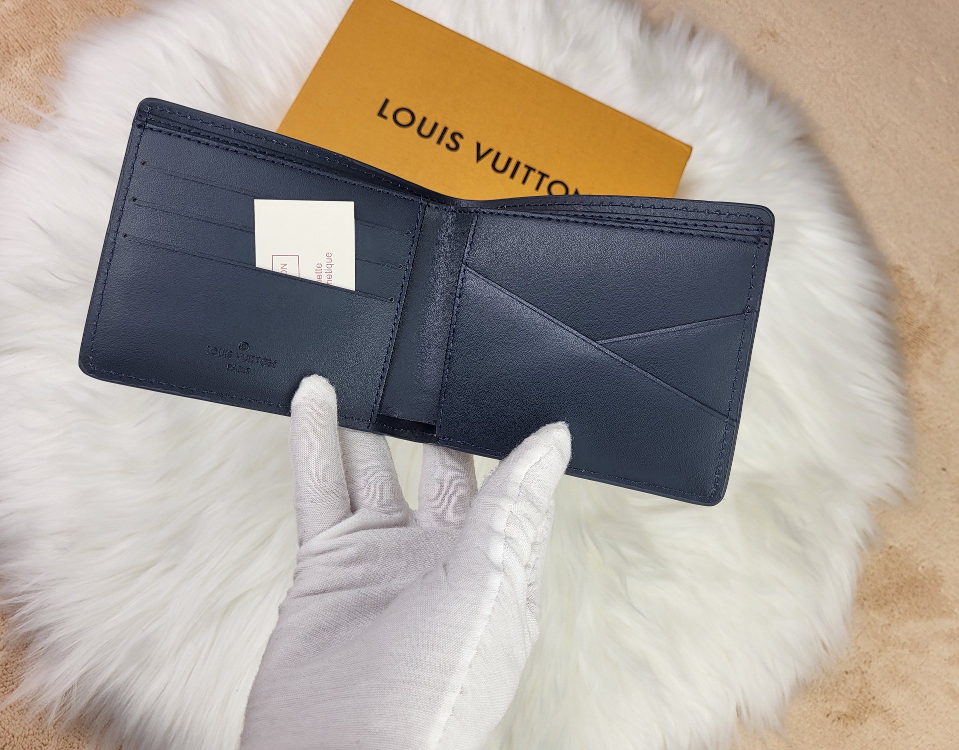Wallet in hand, showing its size