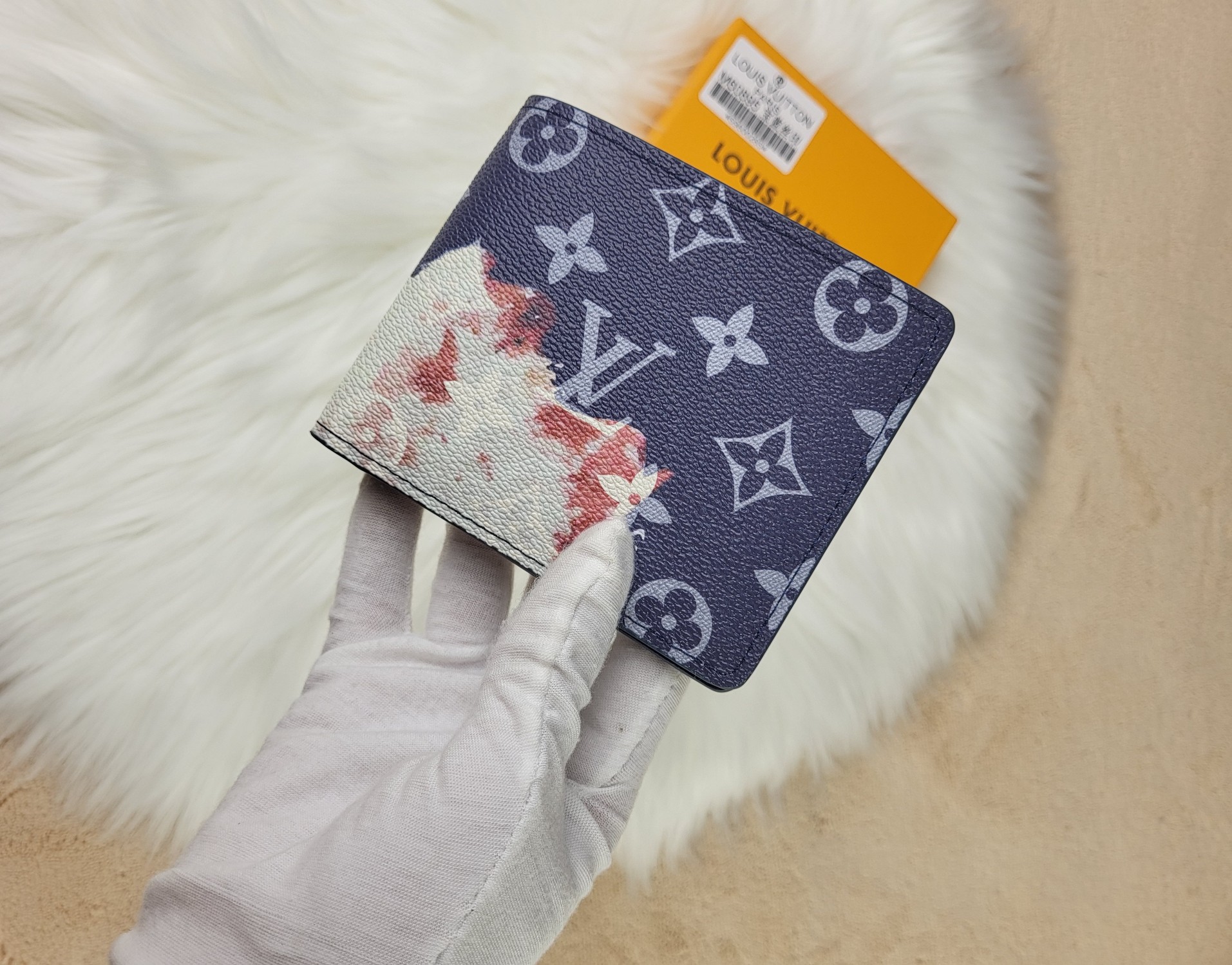 Close-up of the stitching on a leather bifold wallet