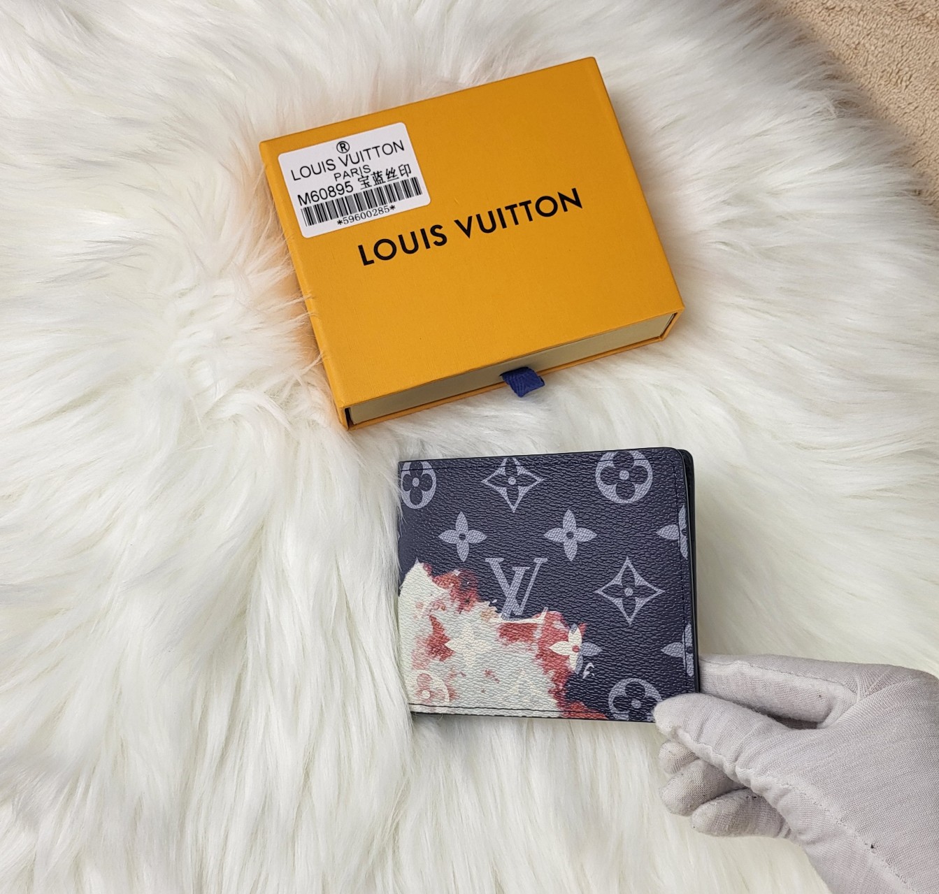 Person holding the leather bifold wallet