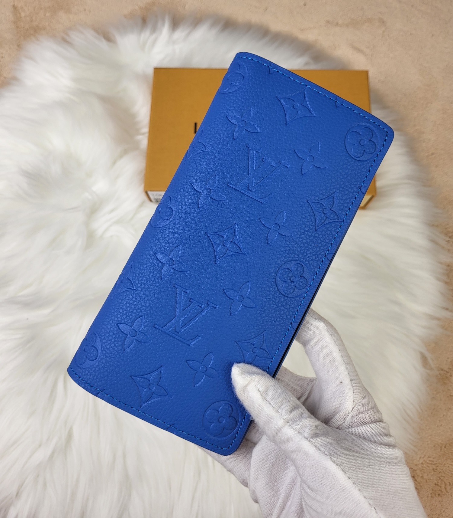 Leather wallet held in hand