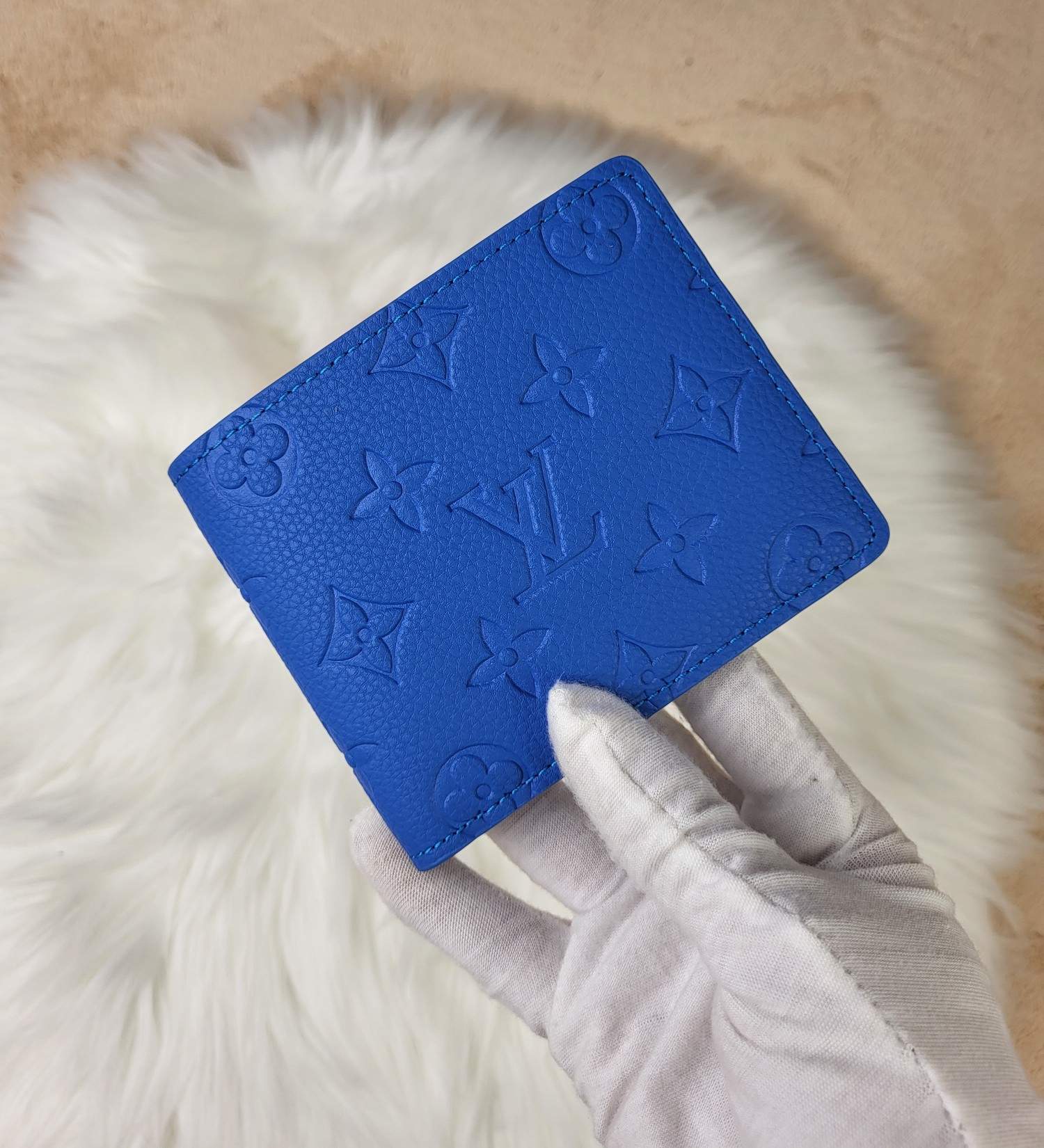 Bifold wallet filled with cards and cash