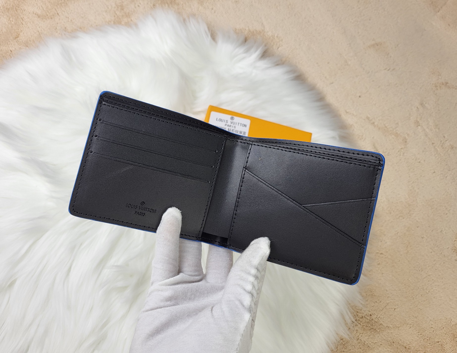 Stitching detail of a leather bifold wallet