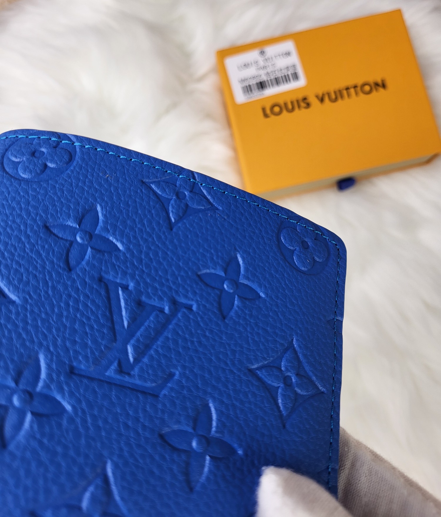 Person holding leather bifold wallet