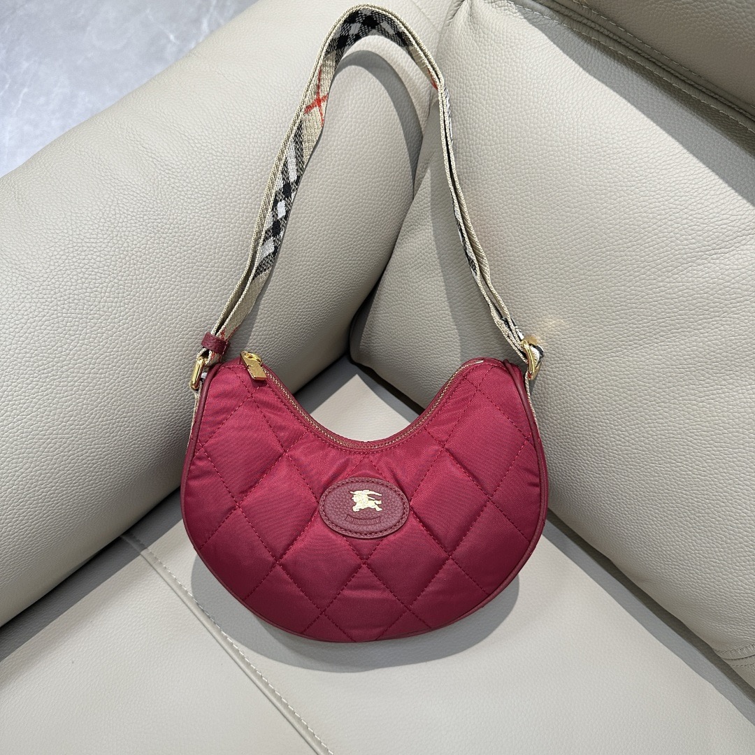 Burberry's new high-end Horseshoe cross-body bag draws inspiration from British countryside elegance. Crafted from a quilted nylon-blend, it's em