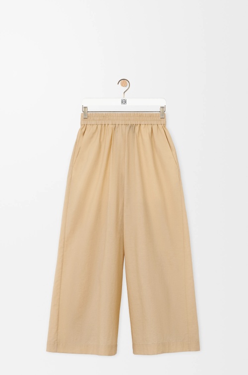 Loewe High-Waisted Wide-Leg Cropped Pants with Logo Elastic Waistband 1 Loewe High-Waisted Wide-Leg Cropped Pants with Logo Elastic Waistband