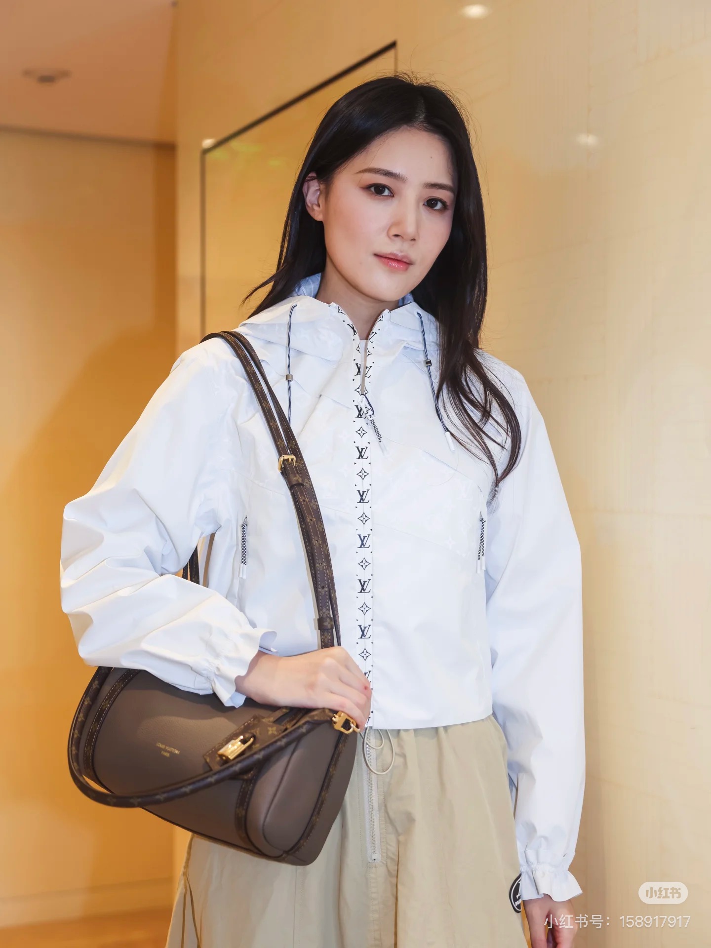 Louis Vuitton Women's White Hooded Jacket with Monogram Detail 1 i1757519528140 3958 0 1