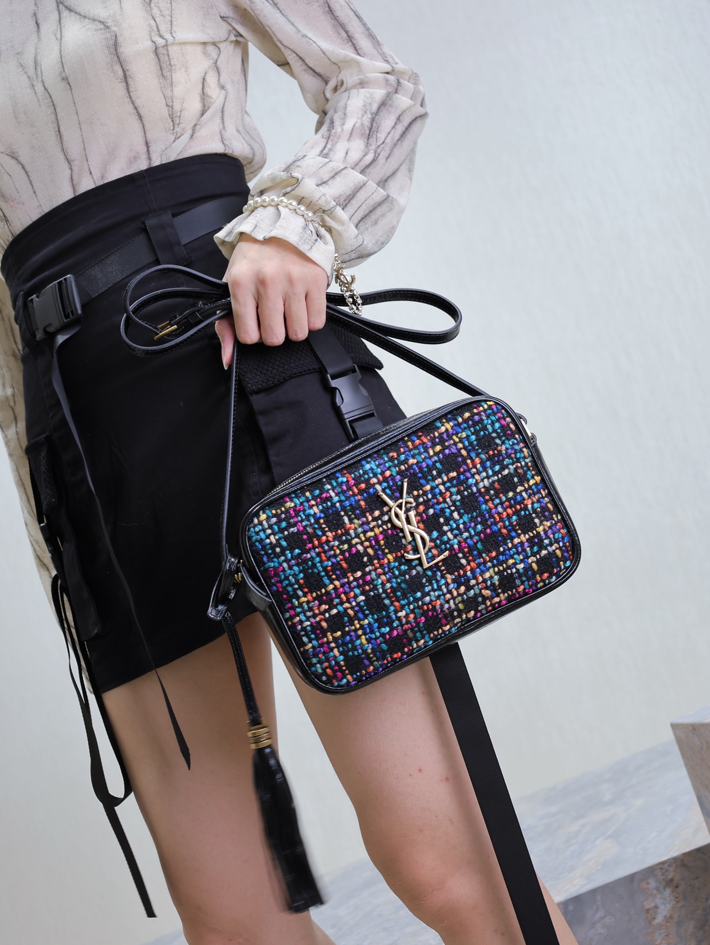 Saint Laurent The tweed bag is lightweight and durable.