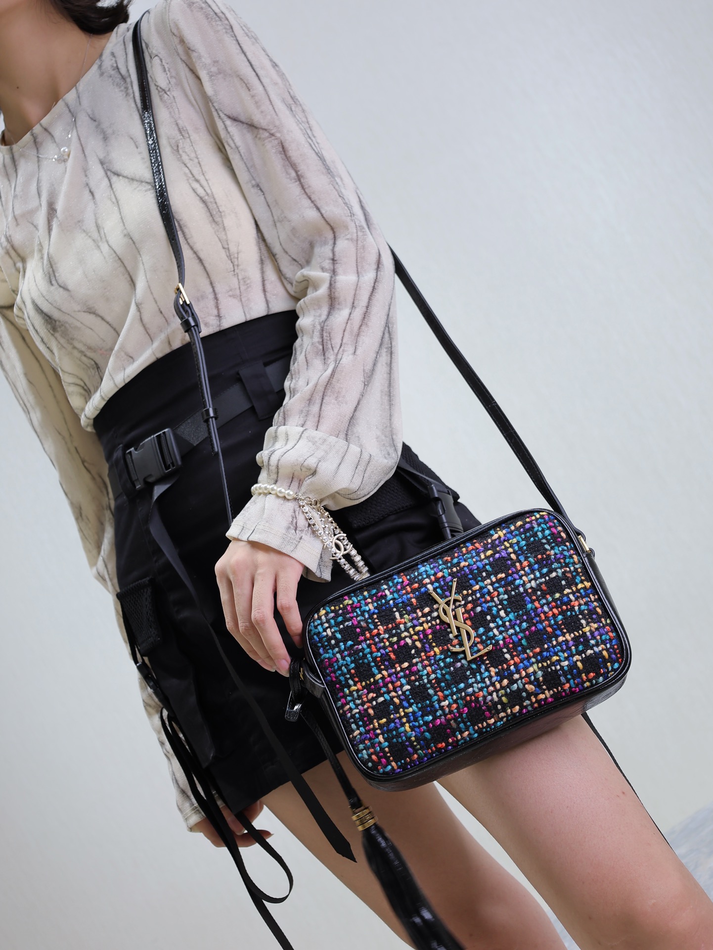Saint Laurent The tweed bag is lightweight and durable.