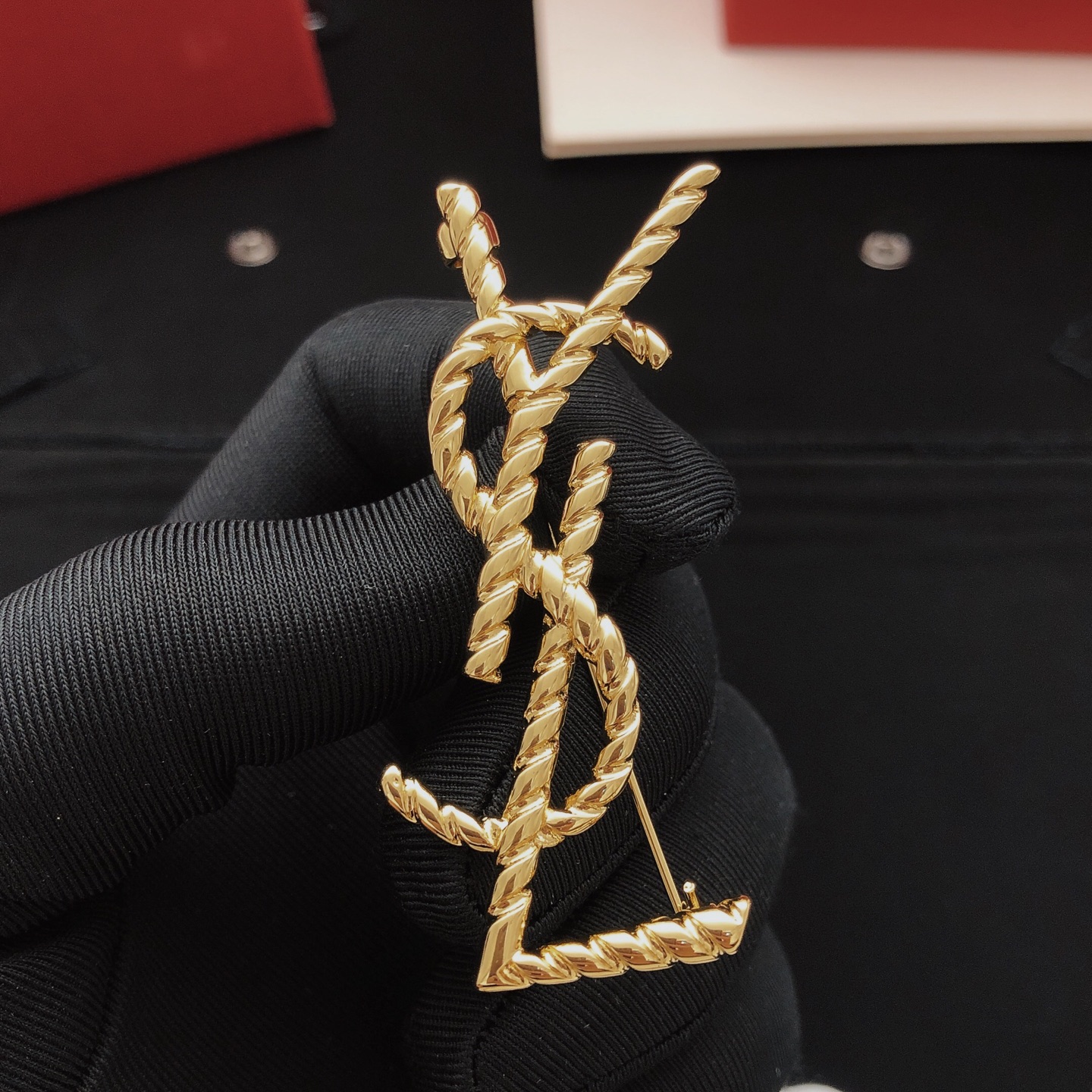 Saint Laurent Cassandre Twisted Monogram Brooch brooch gold-tone metal no gemstones 4 5cm height