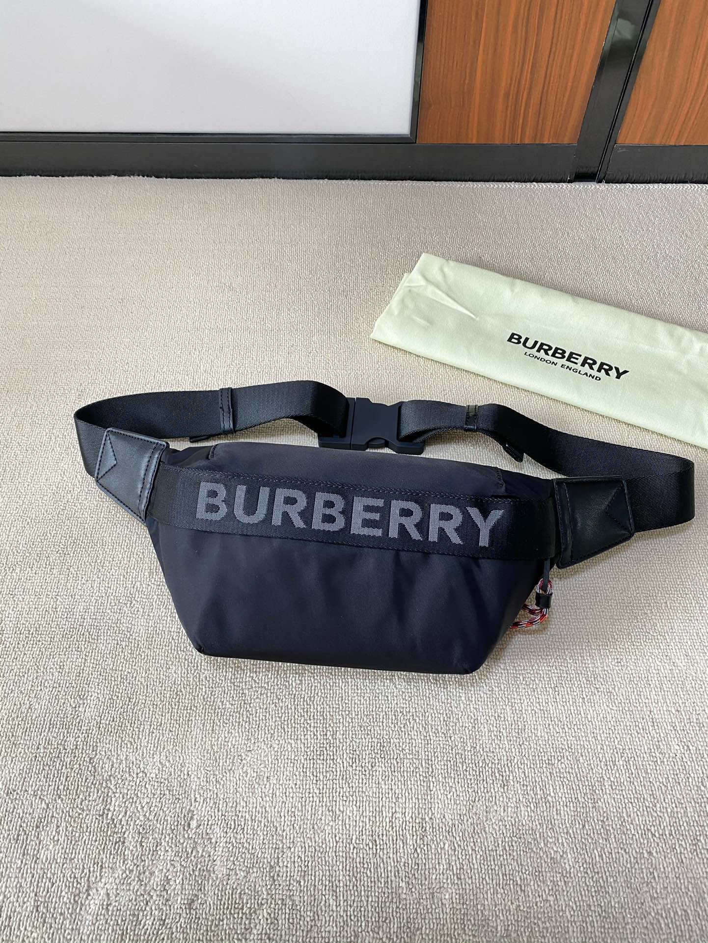 accented with a Burberry textile shoulder strap - Comprehensive