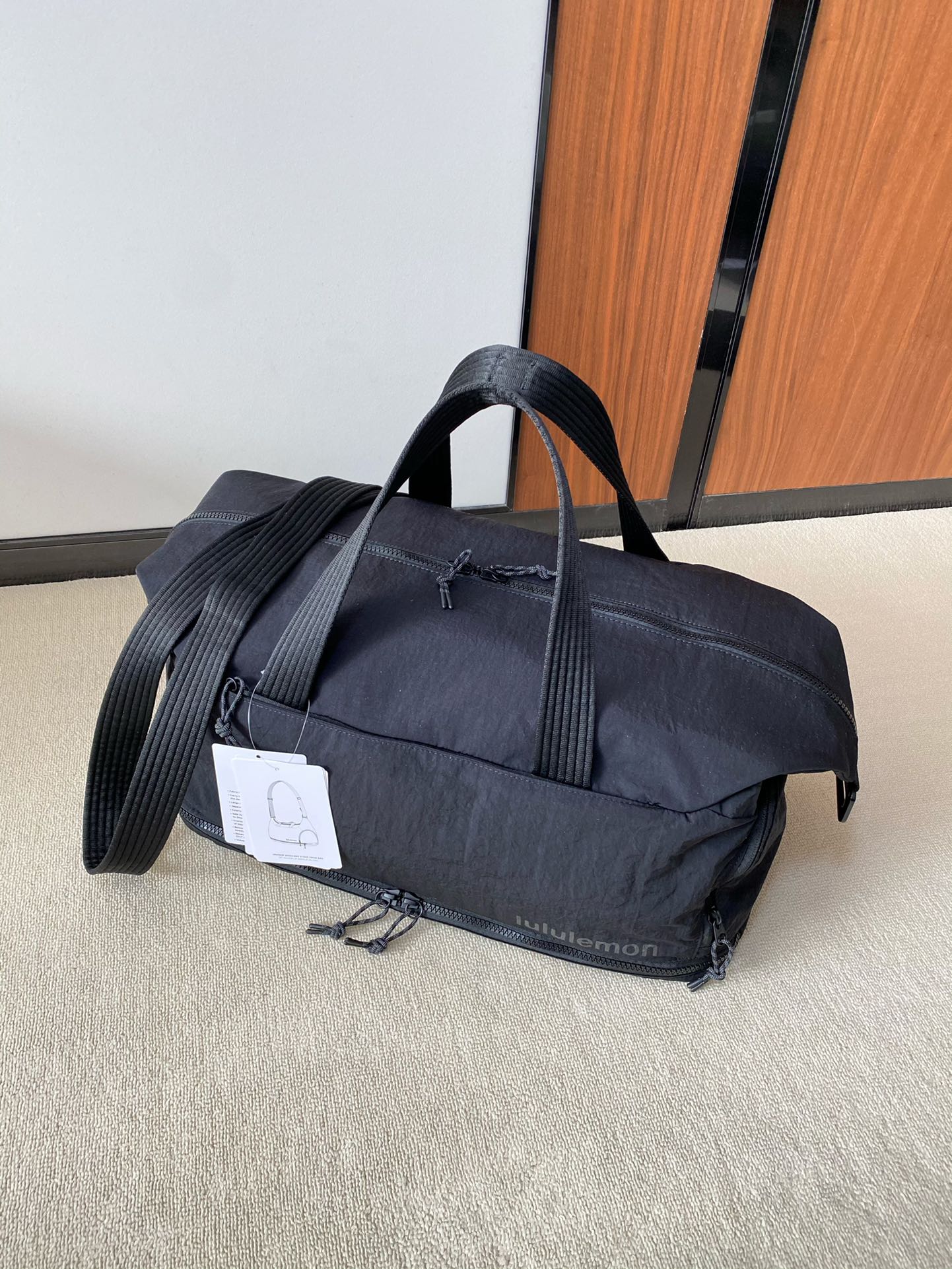 The spacious interior accommodates shoes, clothing, a laptop, an - Comprehensive