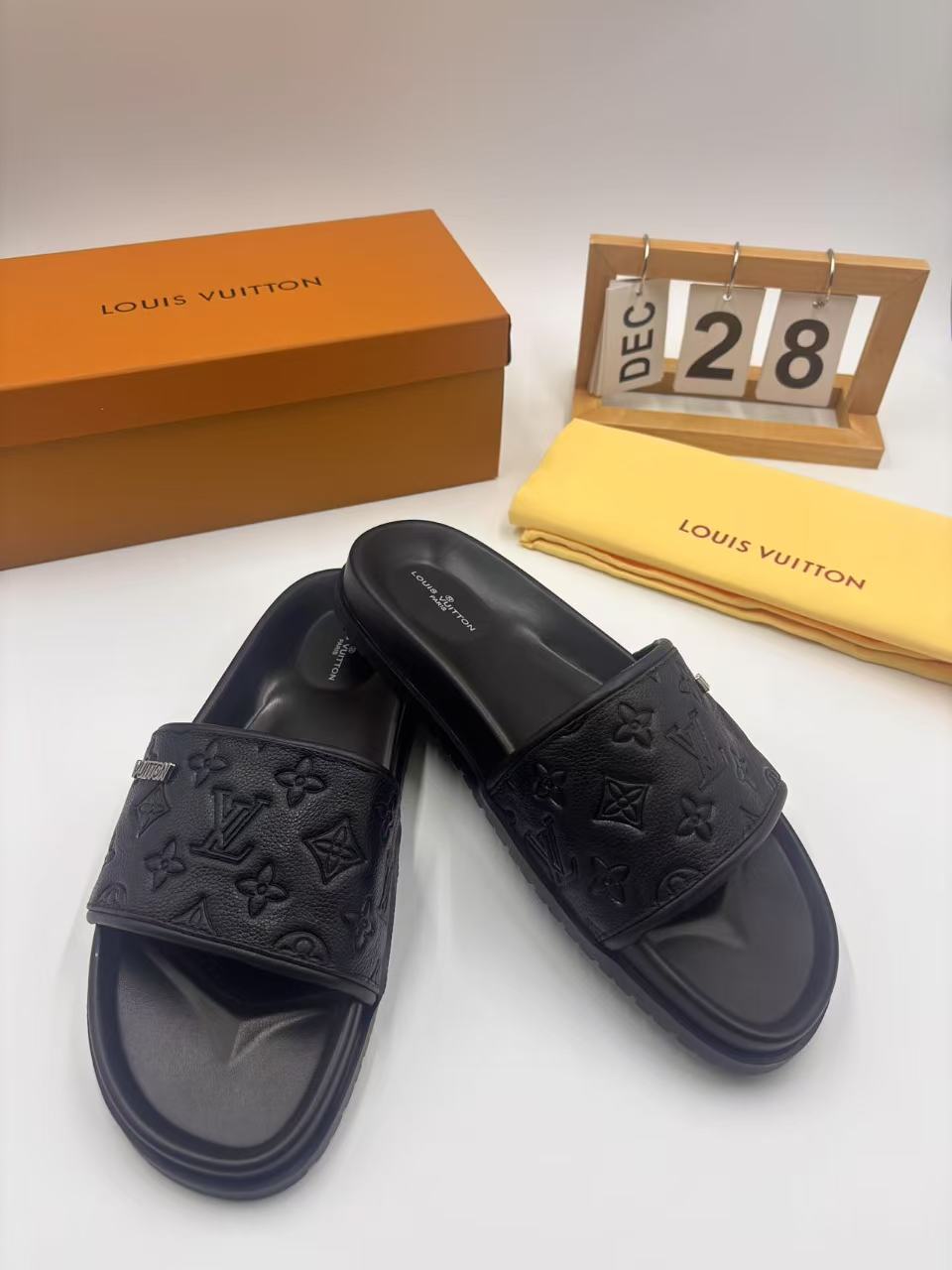 Elegant Louis Vuitton Men's Black Leather Monogram Embossed Slides 5 i1742746322880 2246 0 3