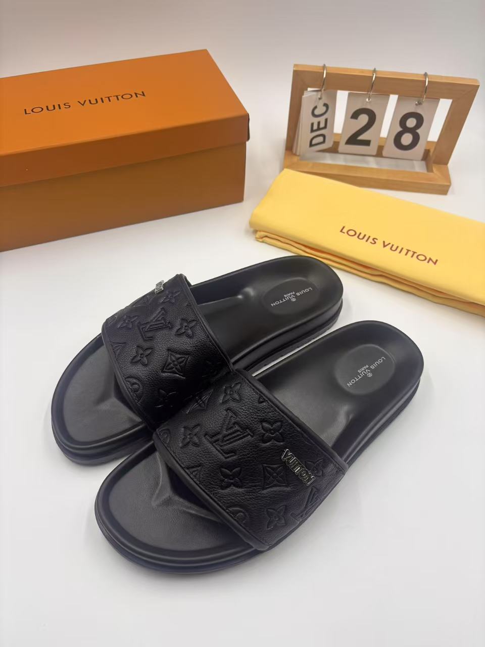 Elegant Louis Vuitton Men's Black Leather Monogram Embossed Slides 4 i1742746322881 1599 0 2