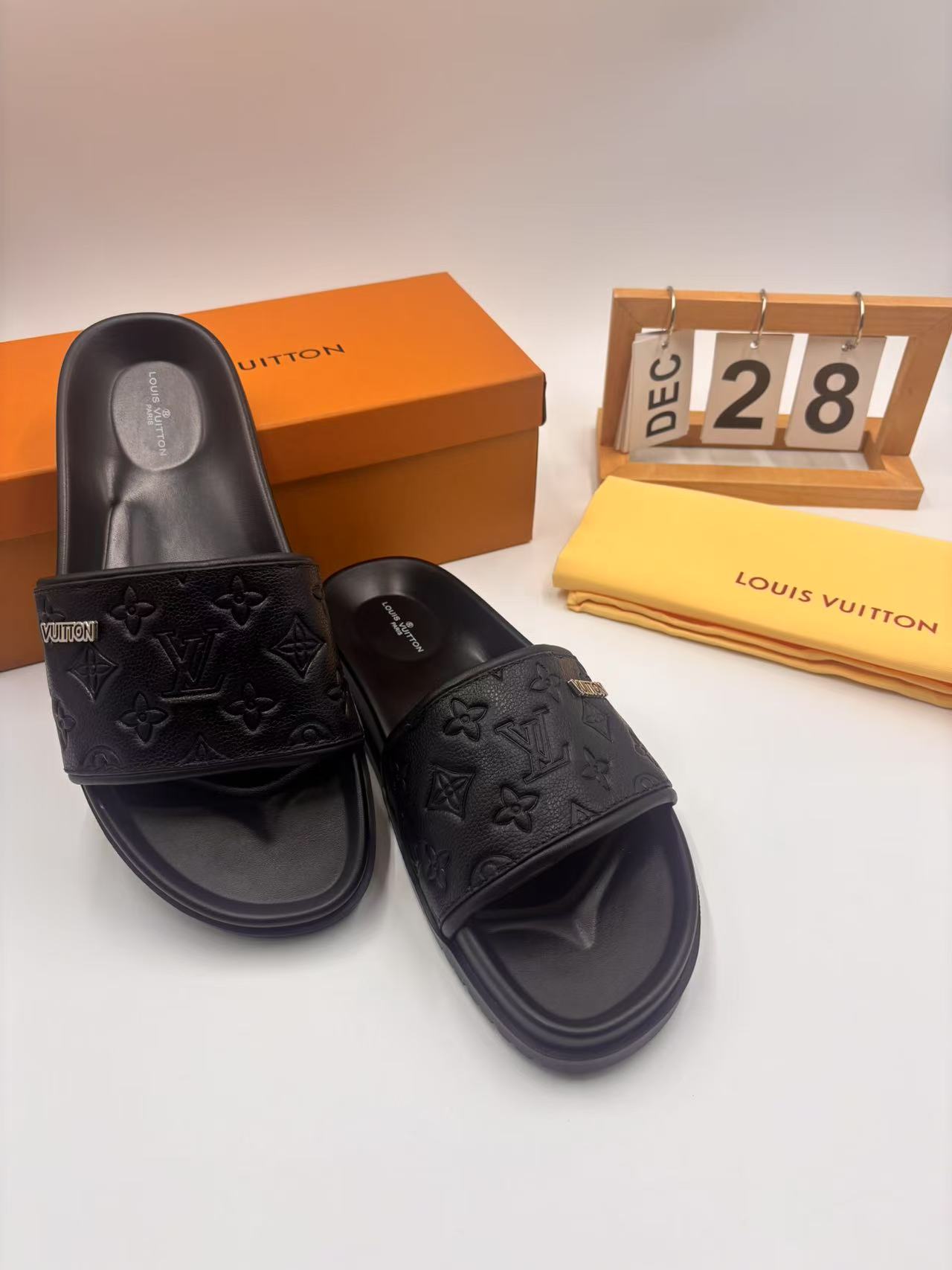 Elegant Louis Vuitton Men's Black Leather Monogram Embossed Slides 6 i1742746322881 2967 0 4